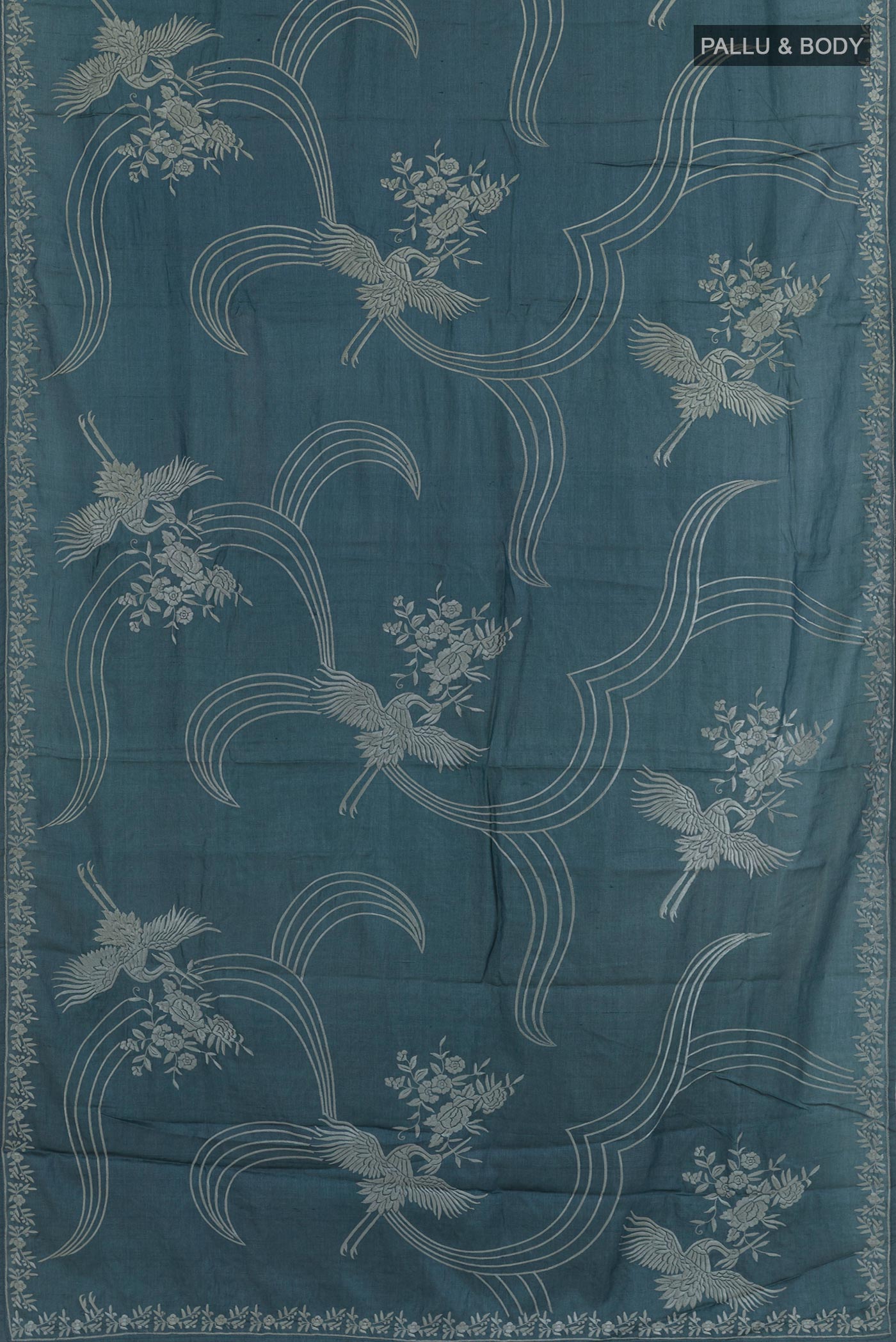 Flat view of Blue Grey Tussar Saree with Embroidery on the body and Embroidery Border. 