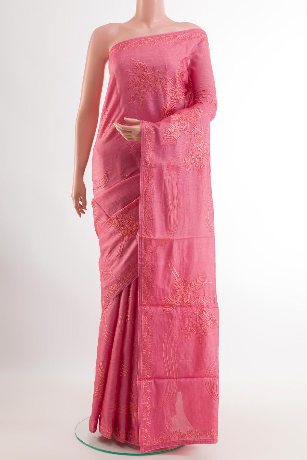 Pink Tussar Saree with Embroidery on the body and Embroidery Border.  displayed on a mannequin