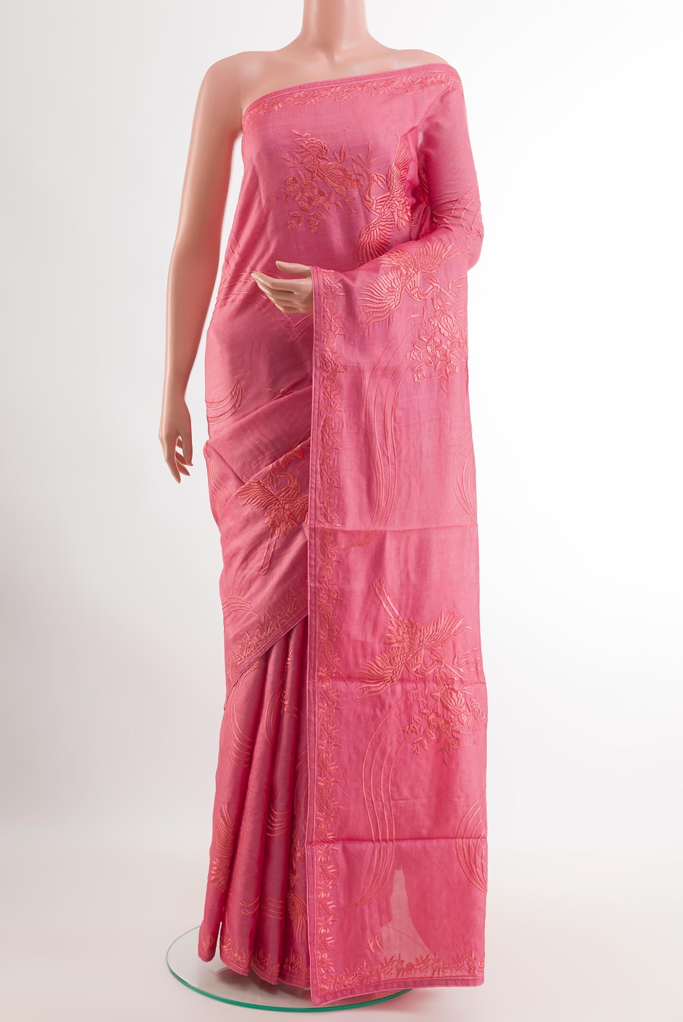 Pink Tussar Saree with Embroidery on the body and Embroidery Border.  displayed on a mannequin