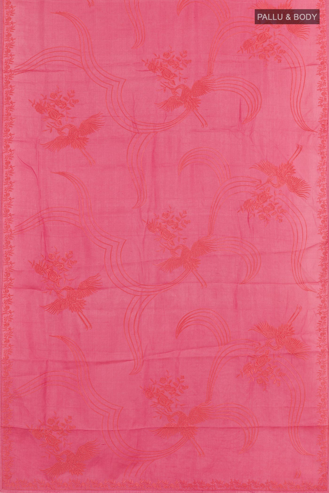 Flat view of Pink Tussar Saree with Embroidery on the body and Embroidery Border. 
