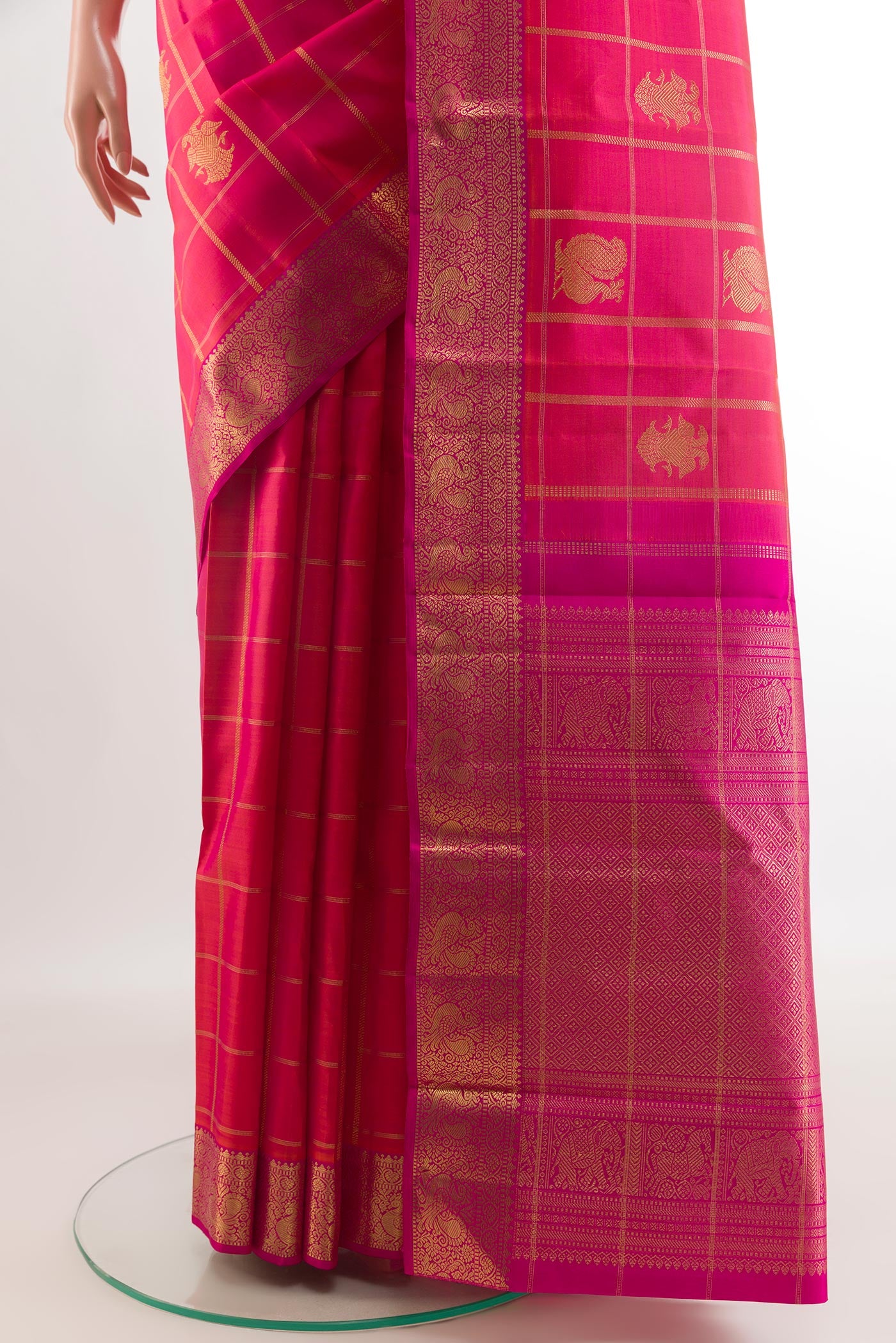 Pleats and pallu of Pink Kanjivaram Silk Saree with Zari Butta on the body and Zari Border. 