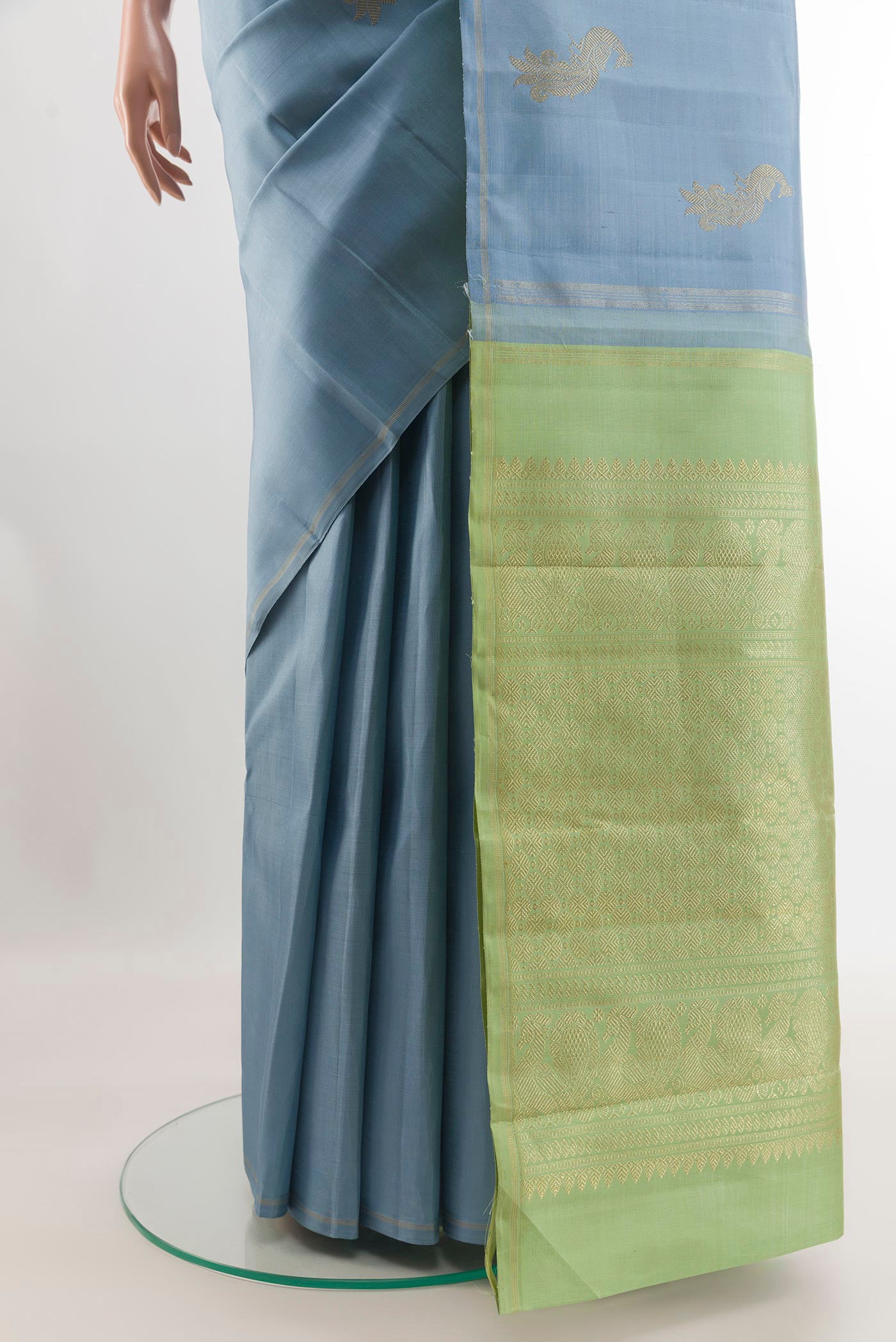 Pleats and pallu of Blue Kanchipuram Silk Saree with Zari Butta on the body and Zari Border. 