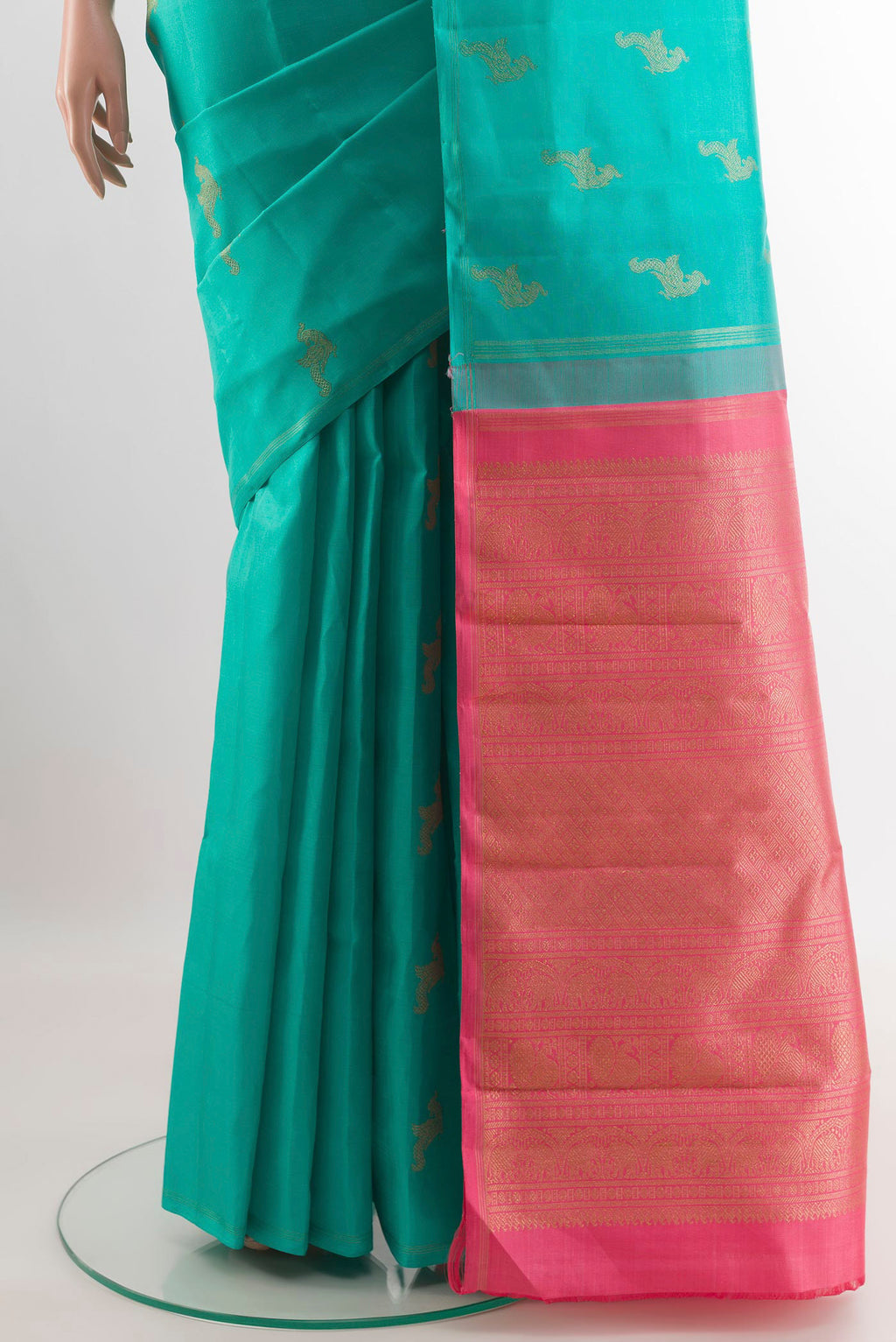 Pleats and pallu of Sea Green Kanchipuram Silk Saree with Zari Butta on the body and Zari Border. 