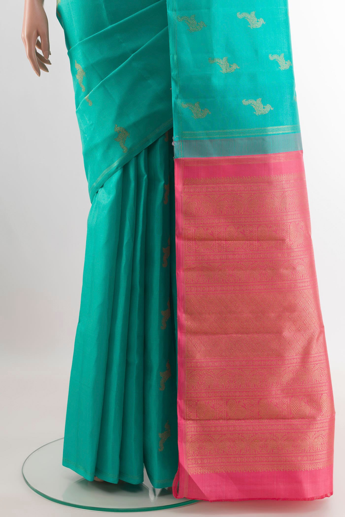 Pleats and pallu of Sea Green Kanchipuram Silk Saree with Zari Butta on the body and Zari Border. 
