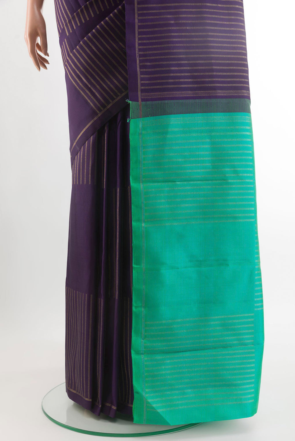 Pleats and pallu of Purple Kanchipuram Silk Saree with Zari Butta on the body and Zari Border. 