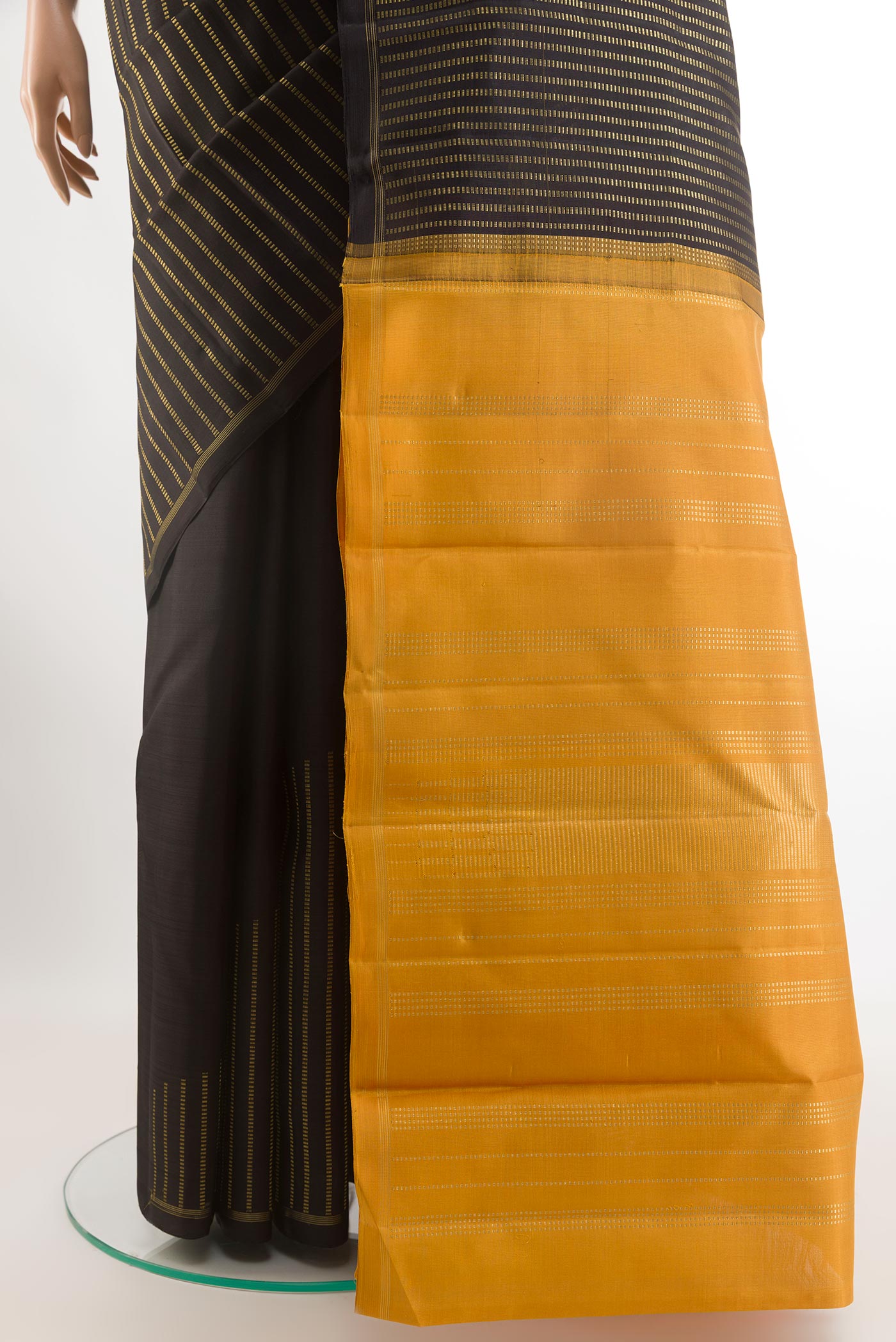 Pleats and pallu of Black Kanchipuram Silk Saree with Stripes on the body and Zari Border. 