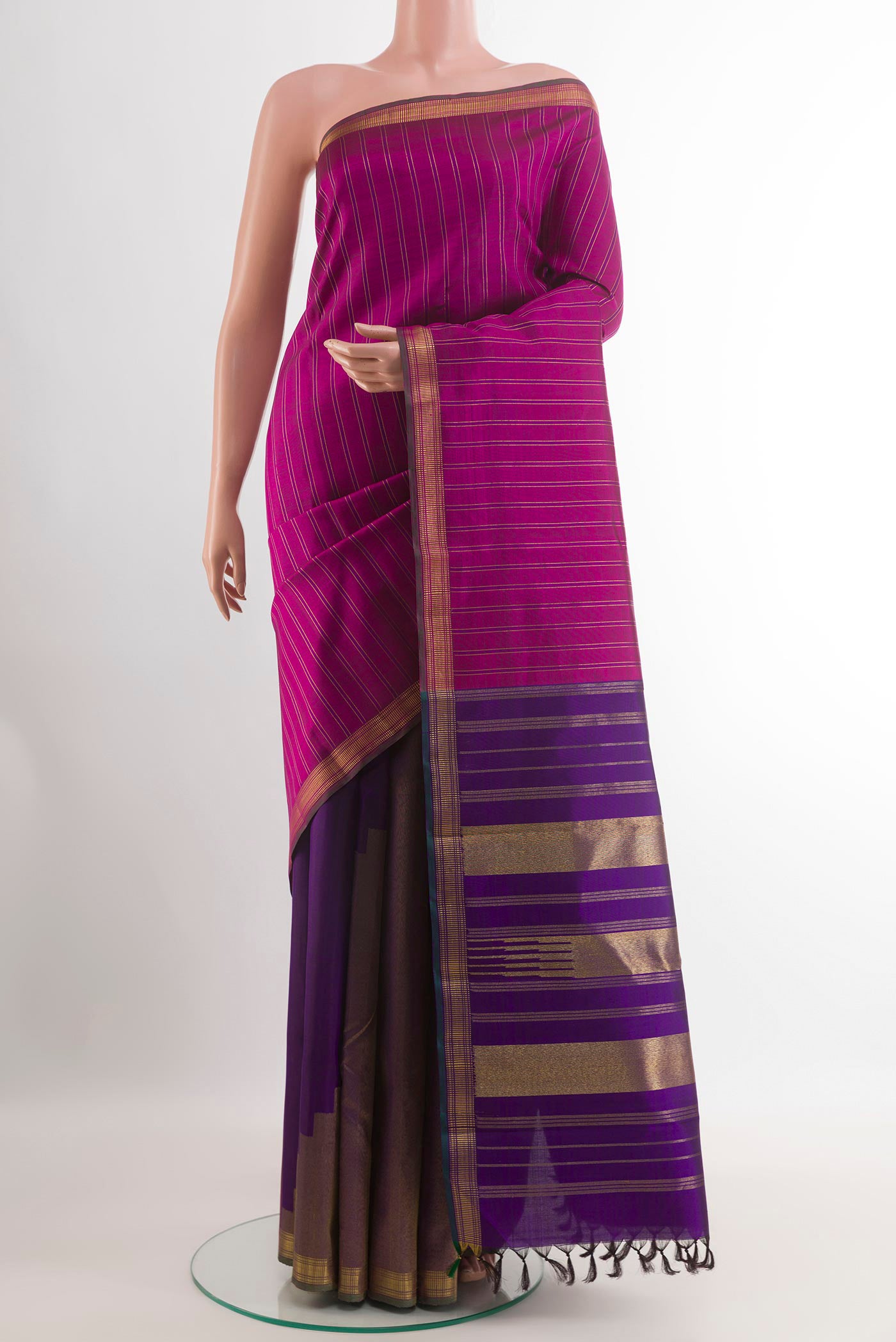 Purple Kanchipuram Silk Saree with Stripes on the body and Zari Border.  displayed on a mannequin
