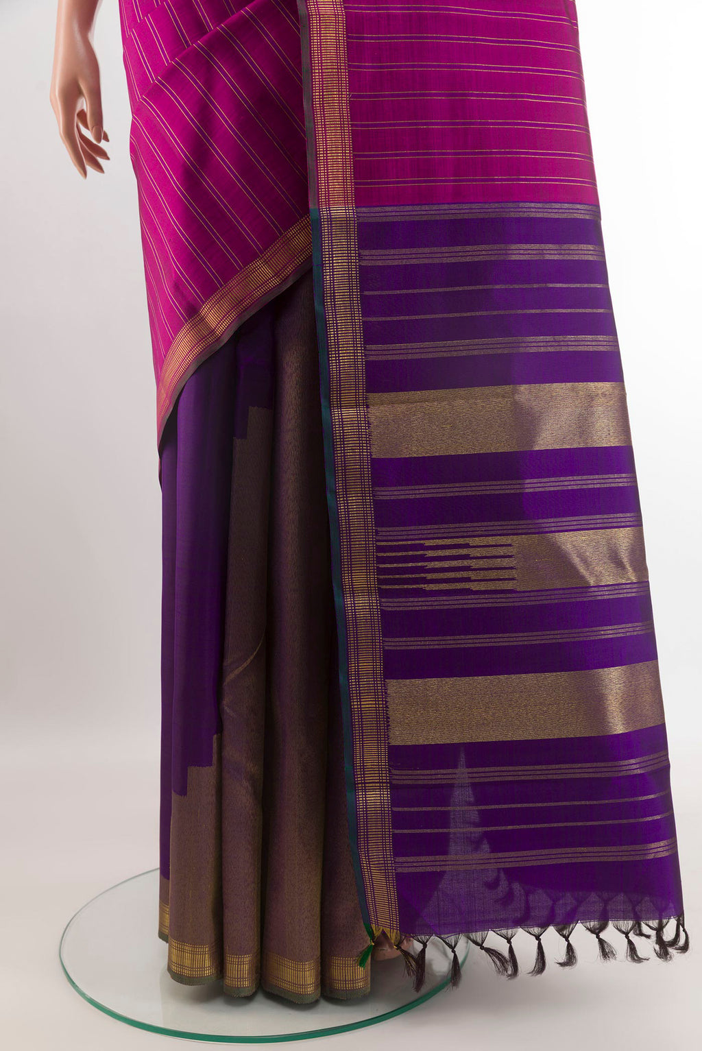 Pleats and pallu of Purple Kanchipuram Silk Saree with Stripes on the body and Zari Border. 