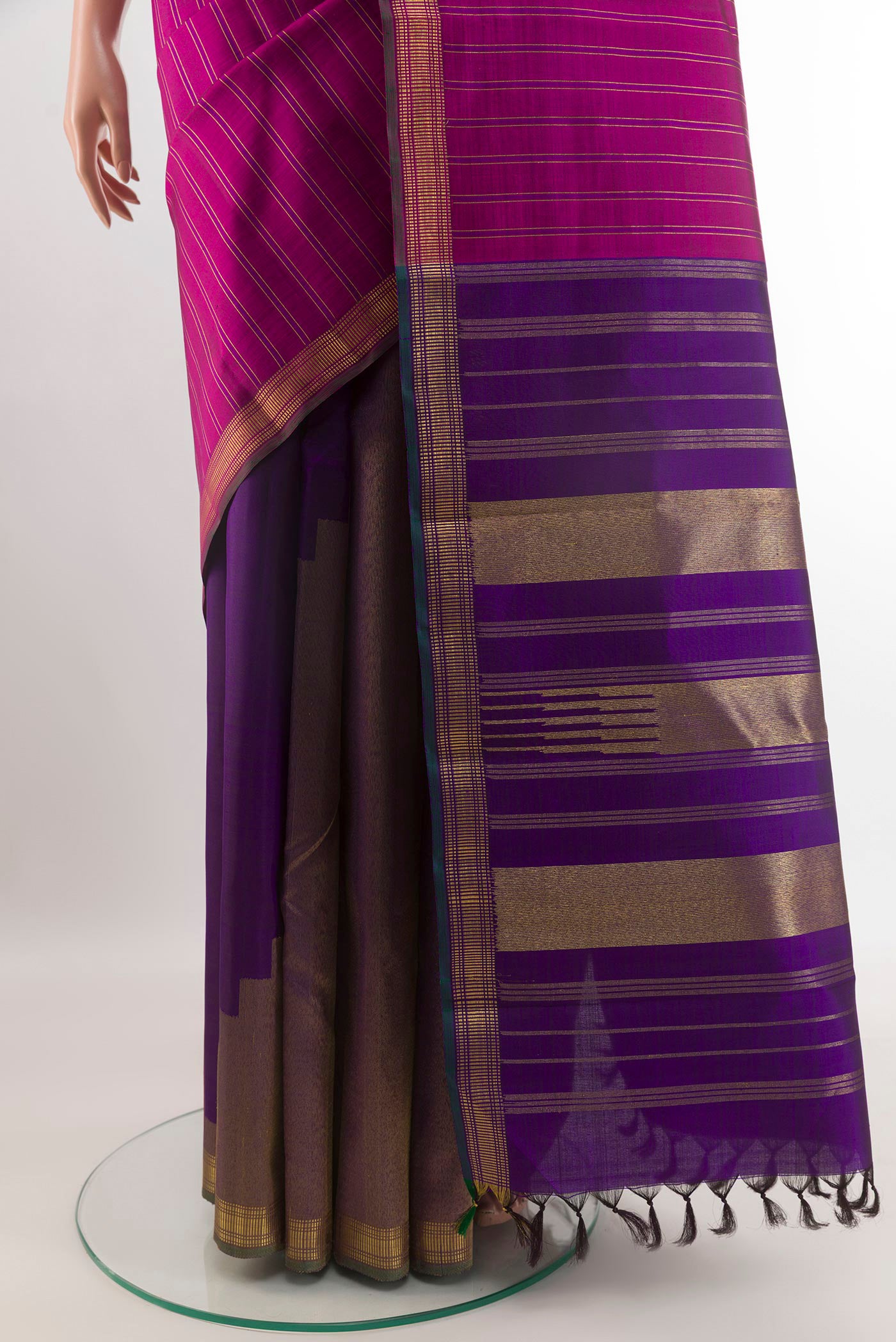 Pleats and pallu of Purple Kanchipuram Silk Saree with Stripes on the body and Zari Border. 
