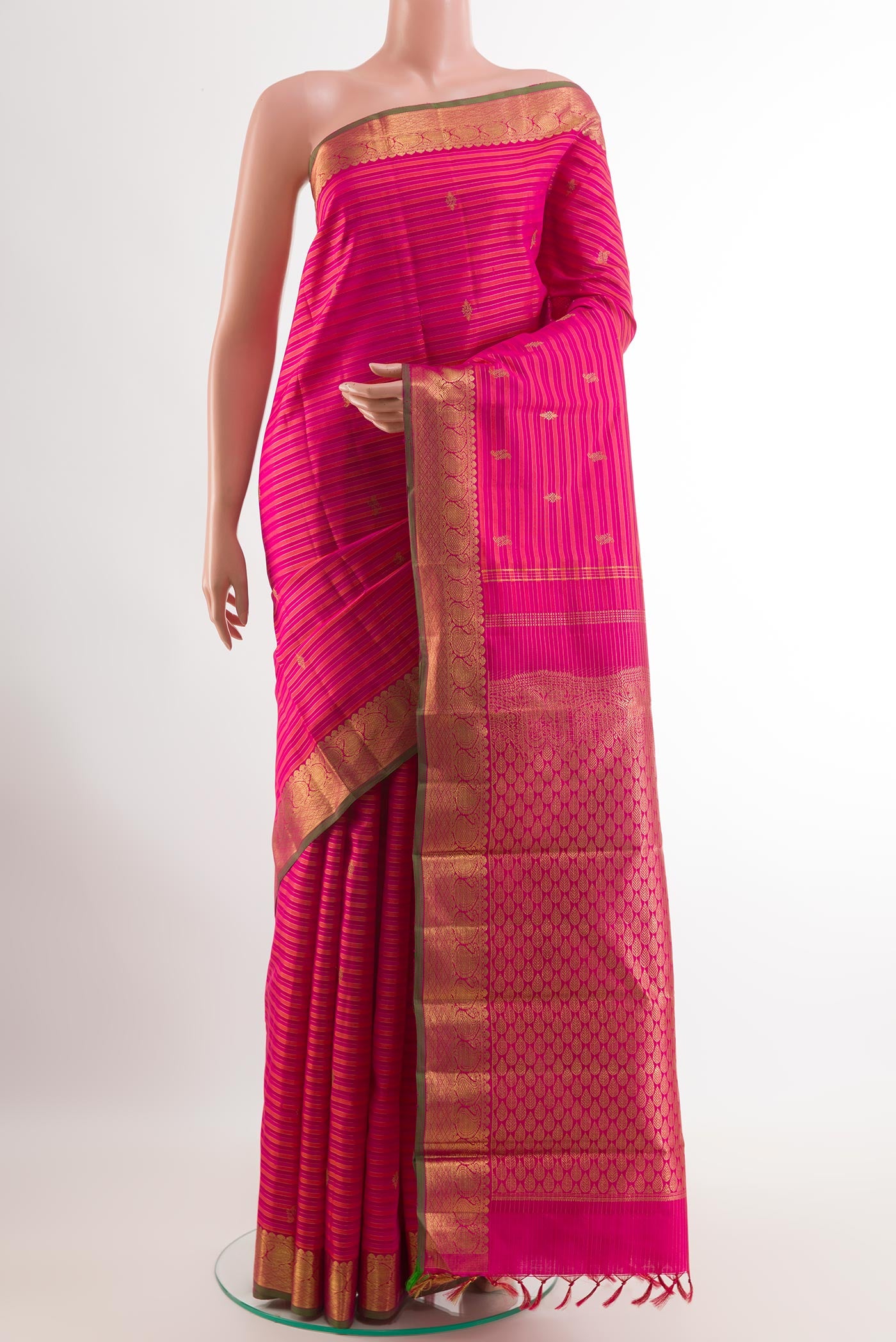 Pink Kanchipuram Silk Saree with Stripes on the body and Zari Border.  displayed on a mannequin