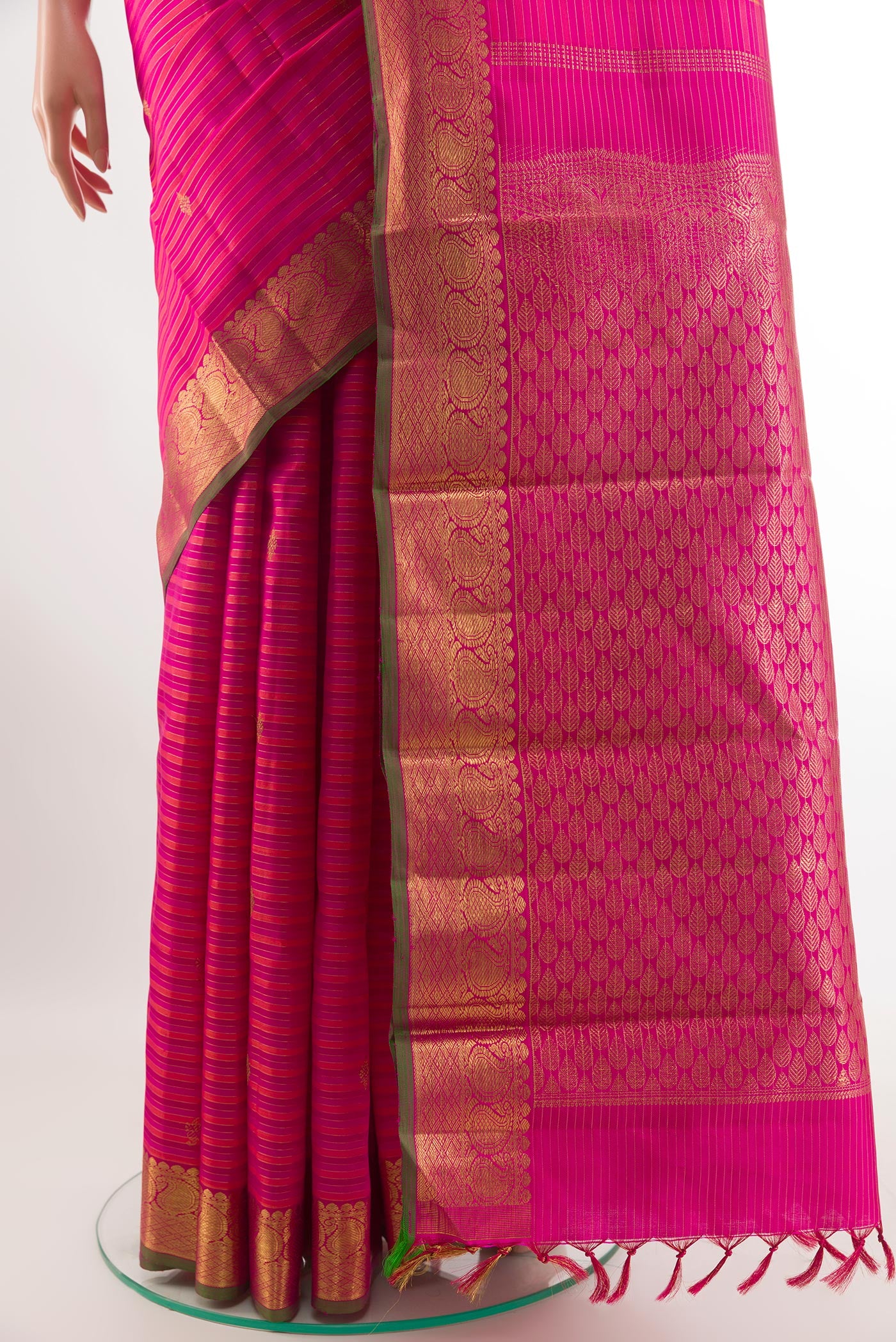 Pleats and pallu of Pink Kanchipuram Silk Saree with Stripes on the body and Zari Border. 