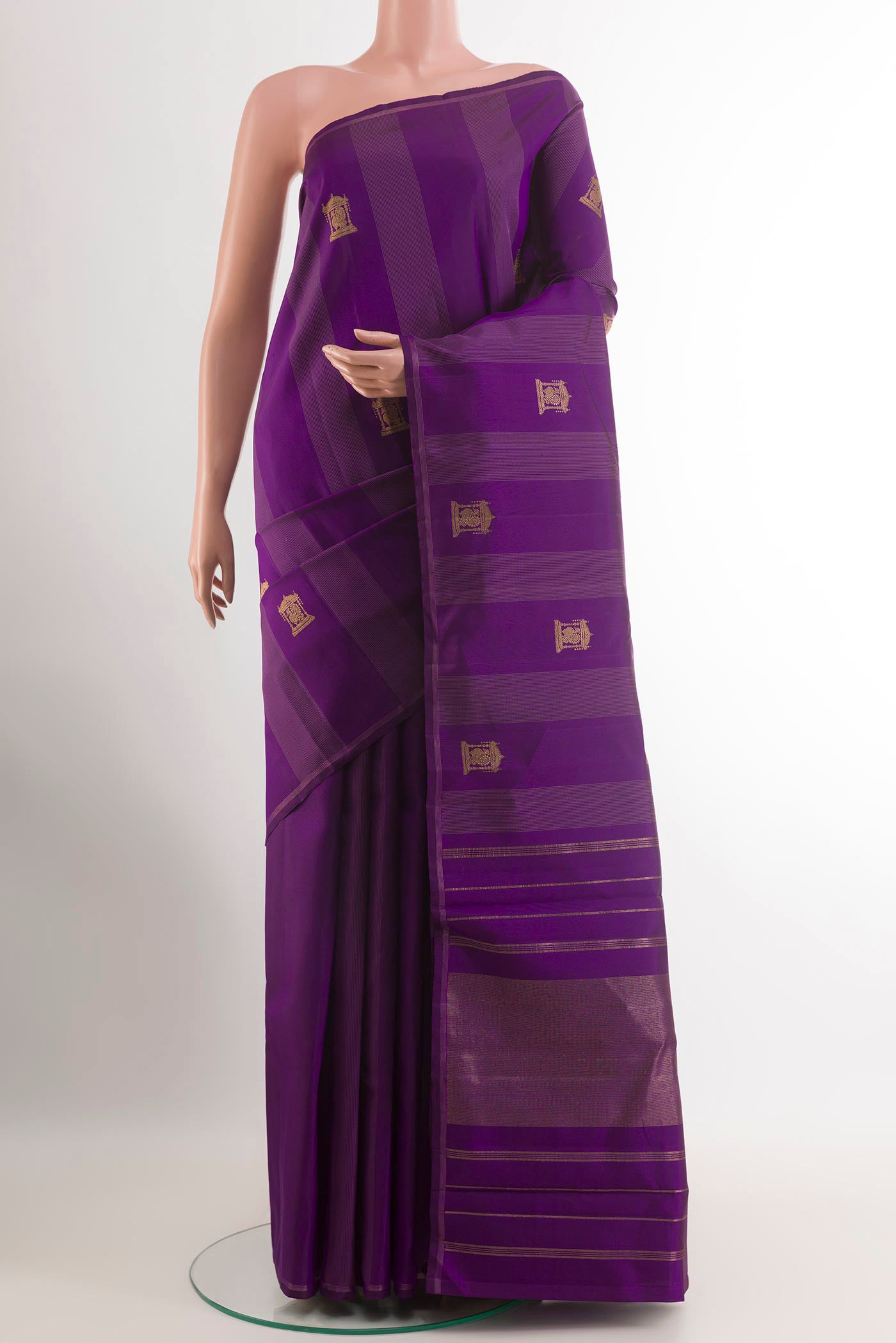 Purple Kanjivaram Silk Saree with Zari Butta on the body and Zari Border.  displayed on a mannequin