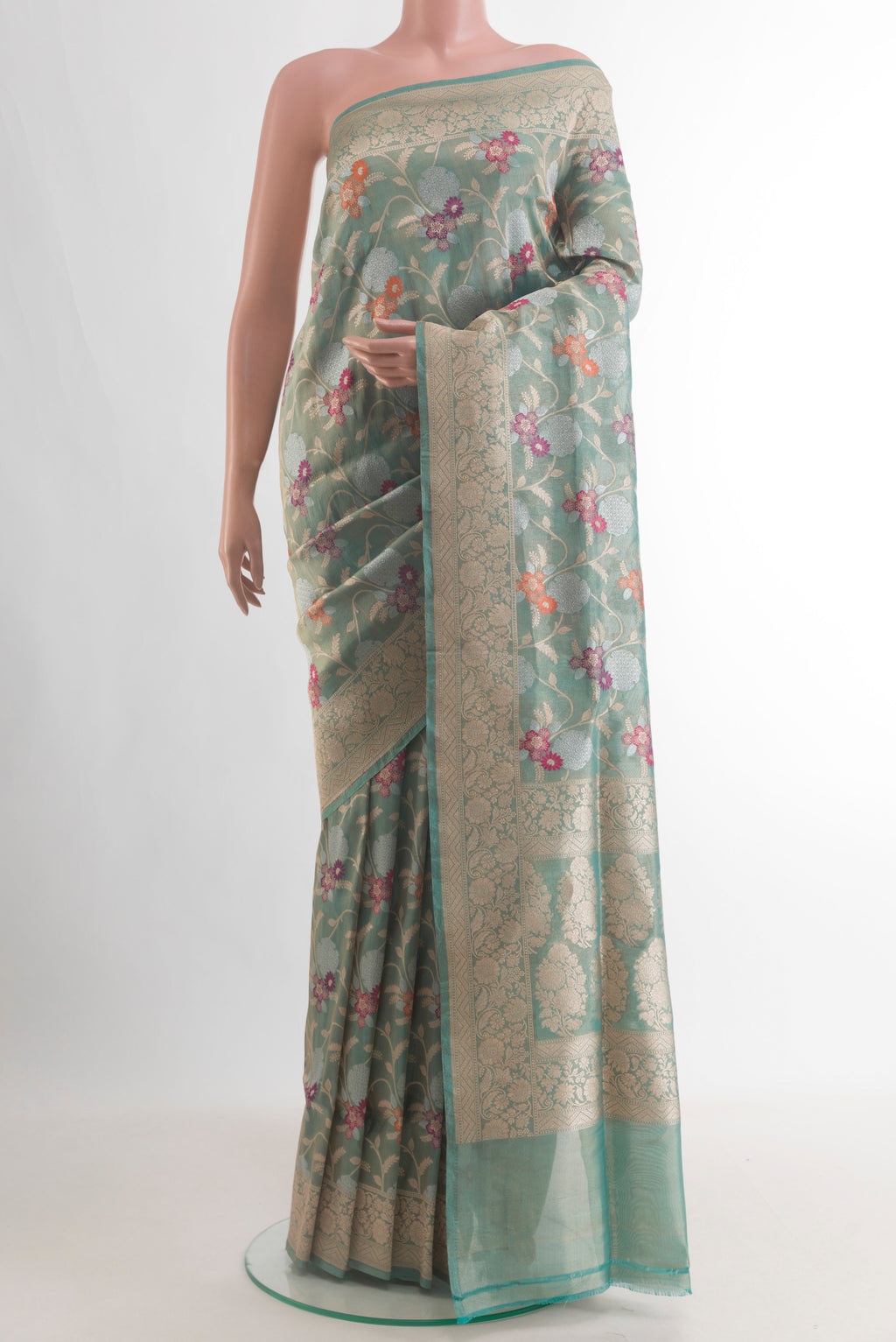 Light Blue Banarasi Tissue Saree with Zari Brocade on the body and Zari Border.  displayed on a mannequin