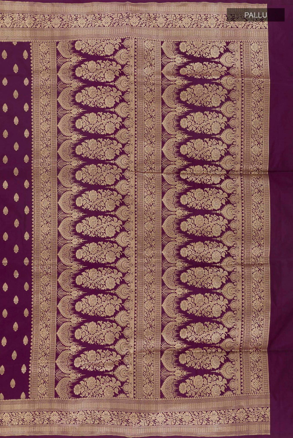 Close up image of the pallu of Purple Banarasi Silk Saree with Zari Butta on the body and Zari Border. 
