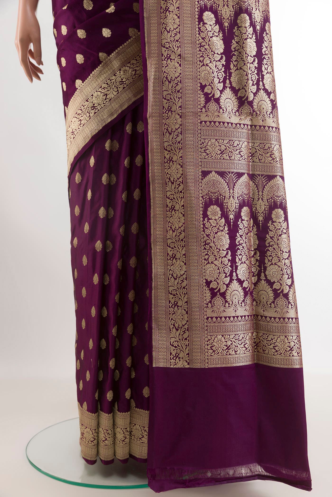 Pleats and pallu of Purple Banarasi Silk Saree with Zari Butta on the body and Zari Border. 