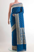 Blue Banarasi Silk Saree with Zari Butta on the body and Zari Border.  displayed on a mannequin