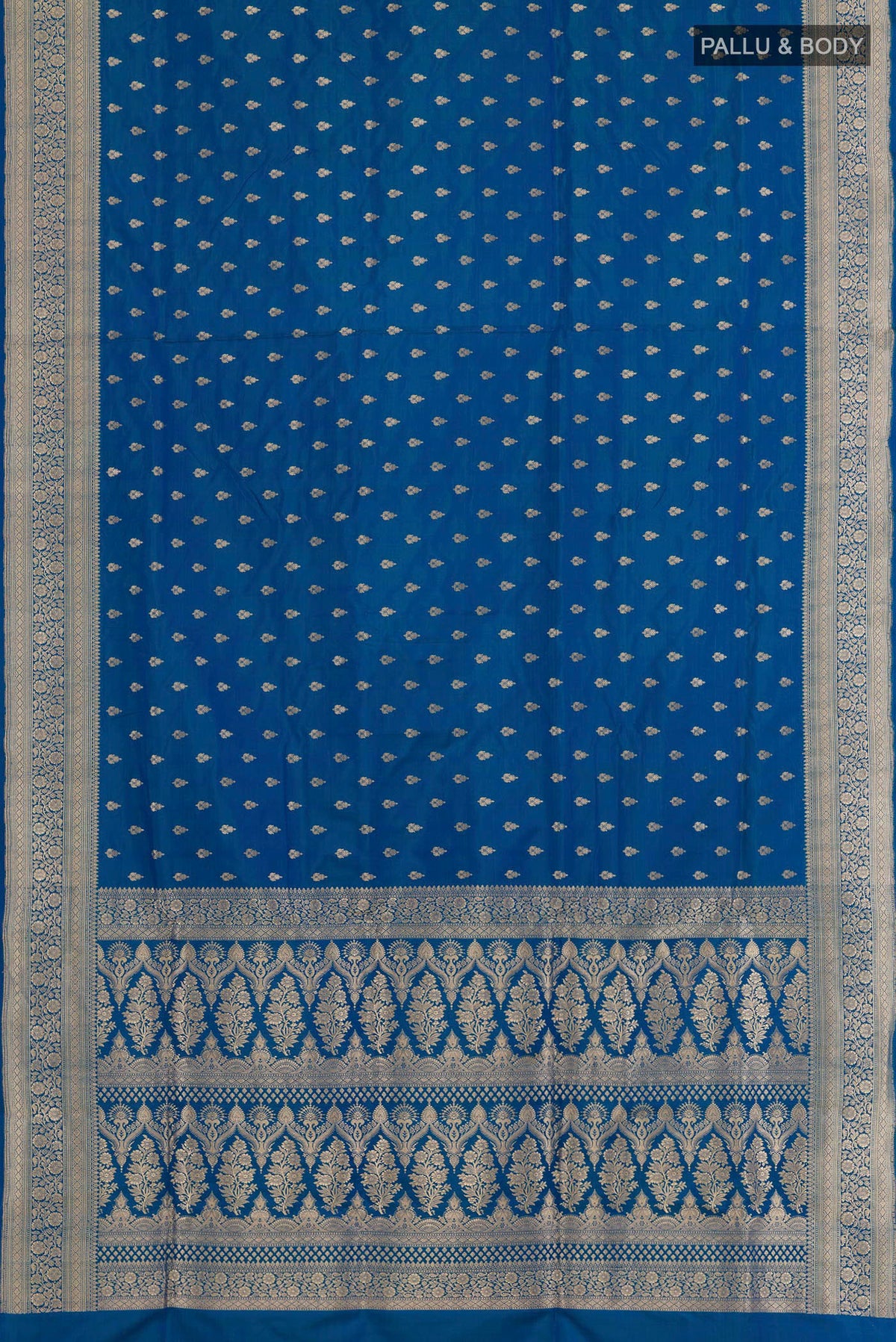 Flat view of Blue Banarasi Silk Saree with Zari Butta on the body and Zari Border. 