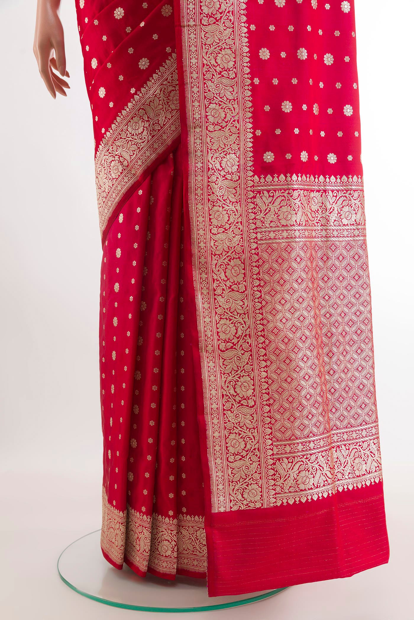 Pleats and pallu of Red Banarasi Silk Saree with Zari Butta on the body and Zari Border. 