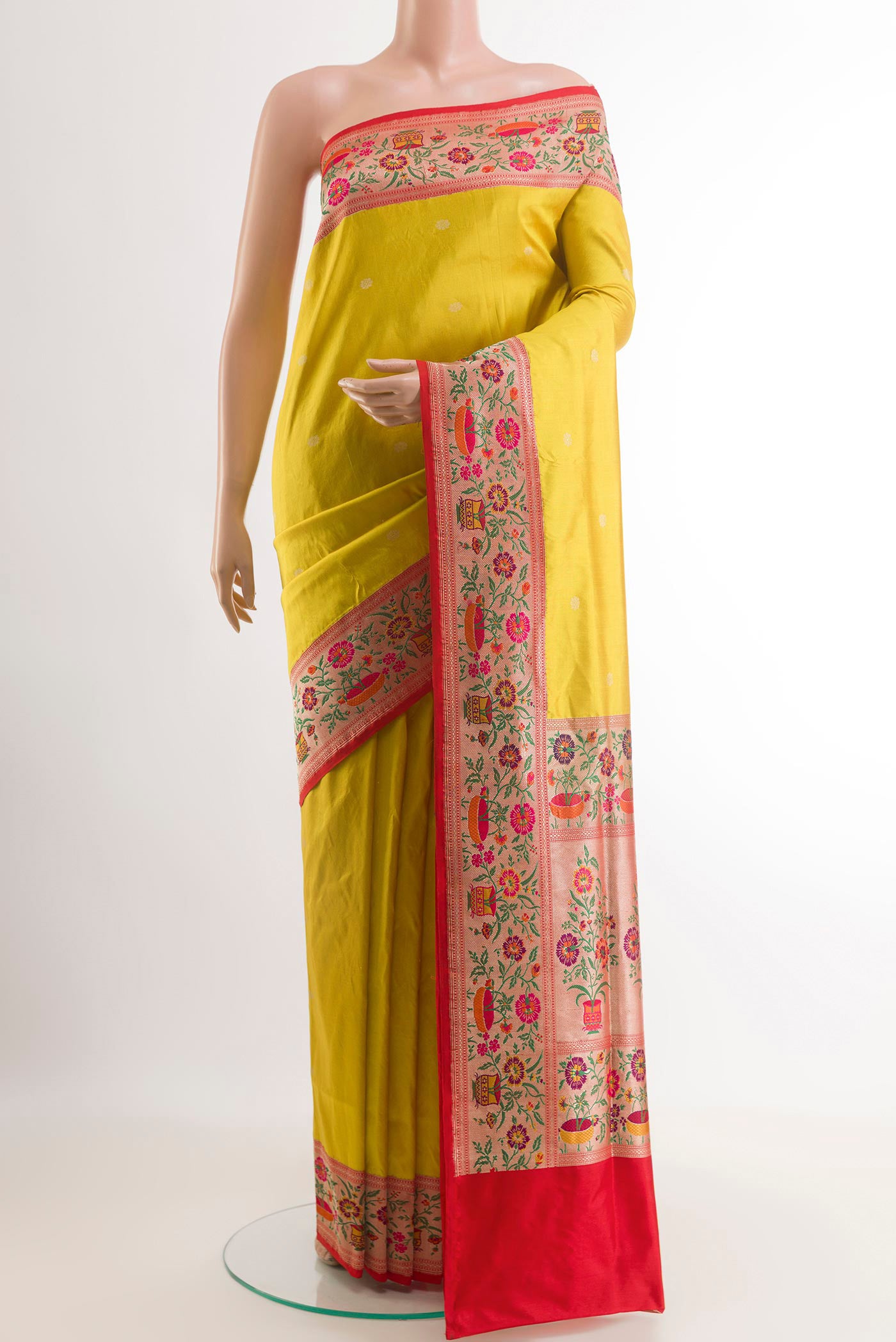 Yellow Banarasi Silk Saree with Zari Butta on the body and Paithani Border.  displayed on a mannequin