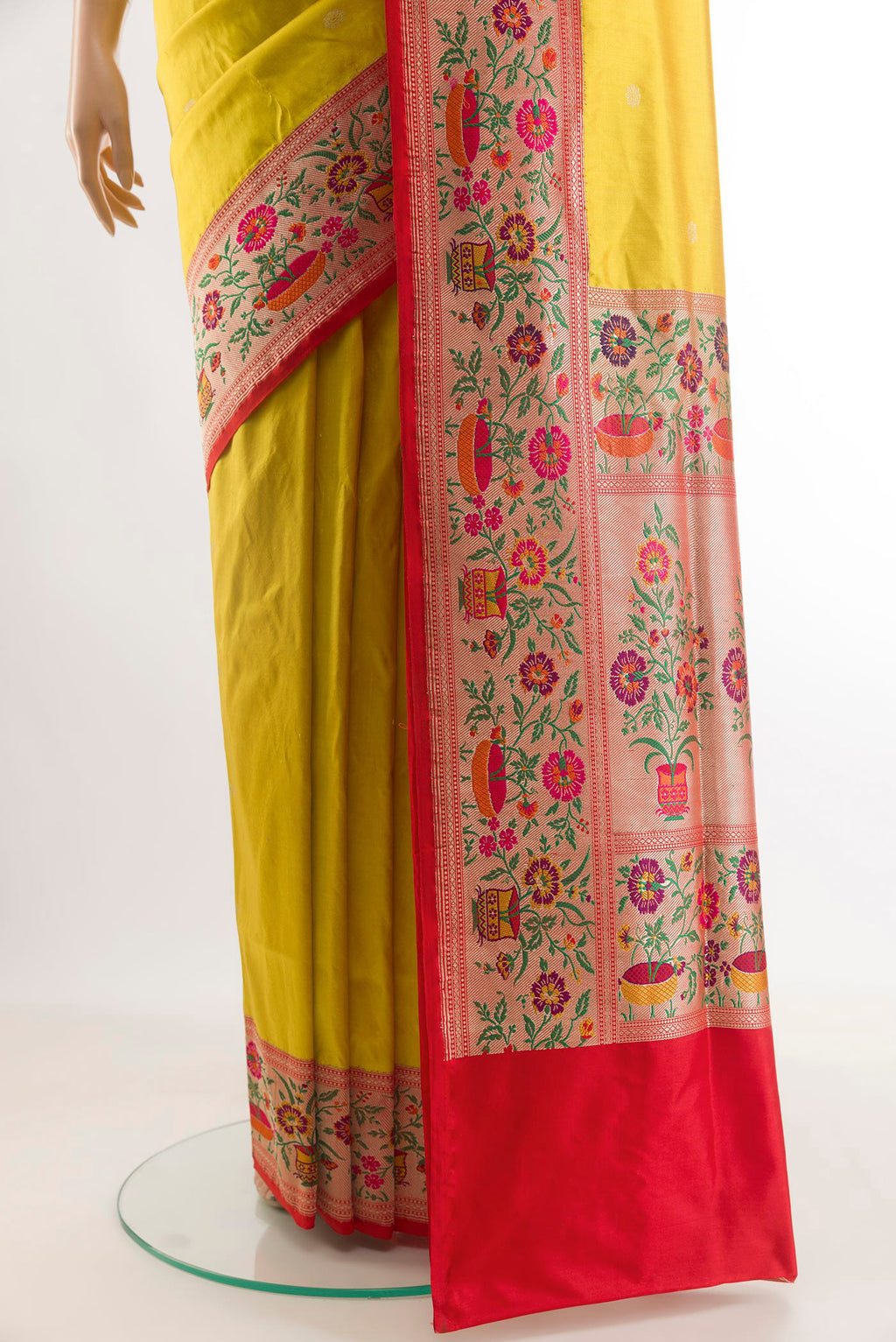 Pleats and pallu of Yellow Banarasi Silk Saree with Zari Butta on the body and Paithani Border. 