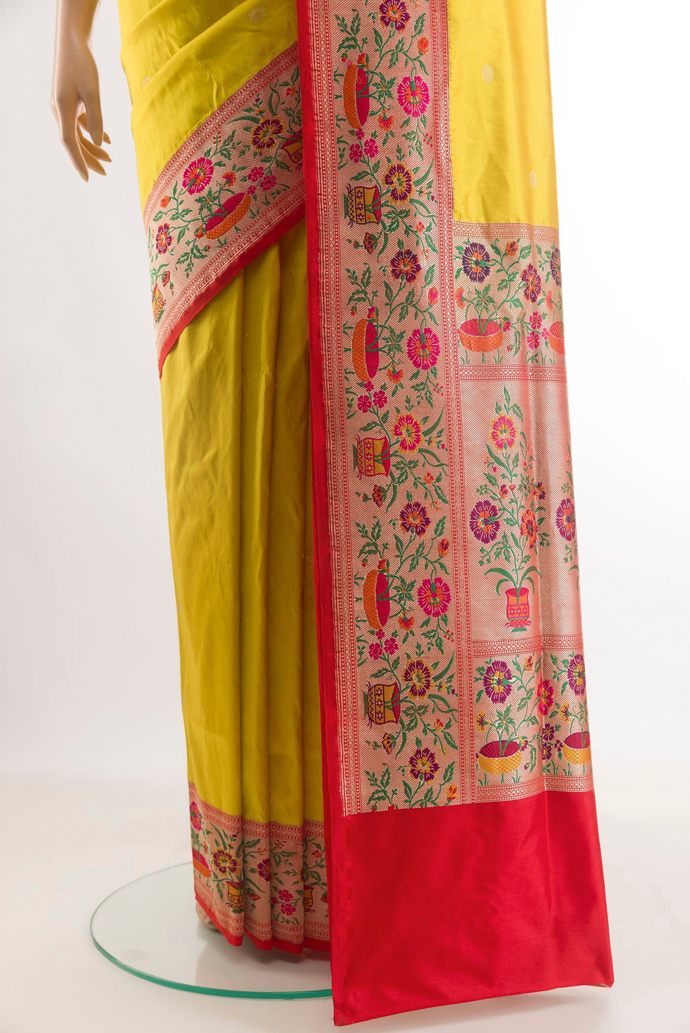 Pleats and pallu of Yellow Banarasi Silk Saree with Zari Butta on the body and Paithani Border. 