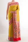 Lemon Yellow Banarasi Silk Saree with Zari Butta on the body and Zari Border.  displayed on a mannequin
