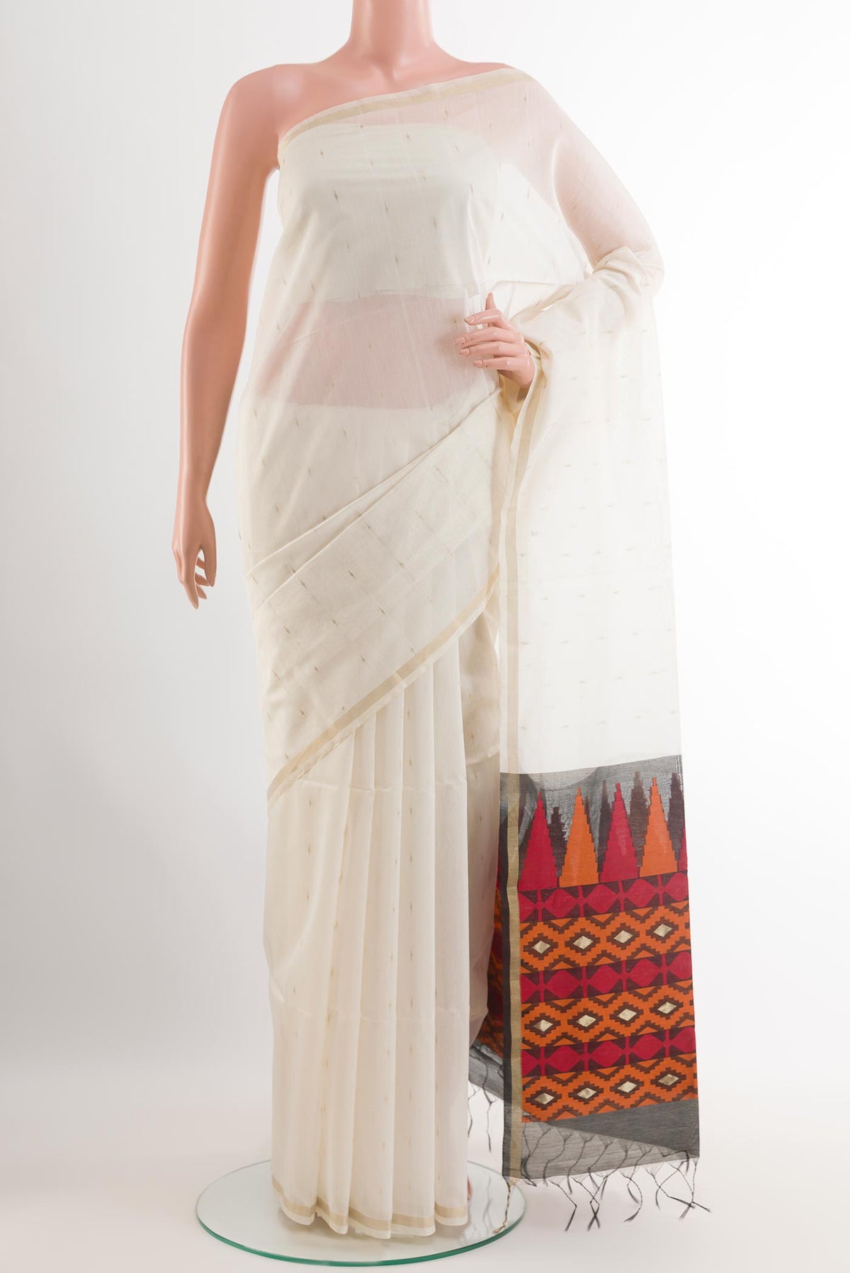 Off White Blended Kora Cotton Saree with Zari Butta on the body and Zari Border.  displayed on a mannequin