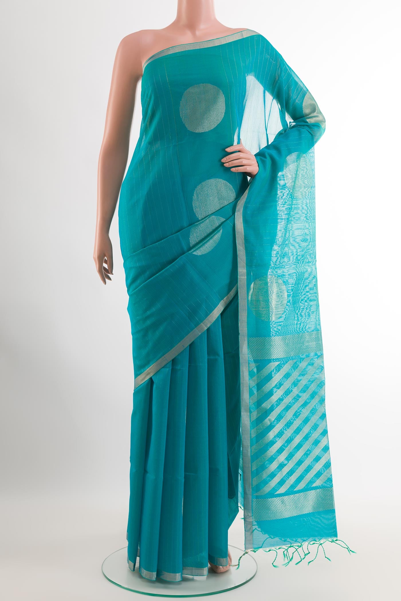 Blue Blended Kora Cotton Saree with Zari Butta on the body and Zari Border.  displayed on a mannequin