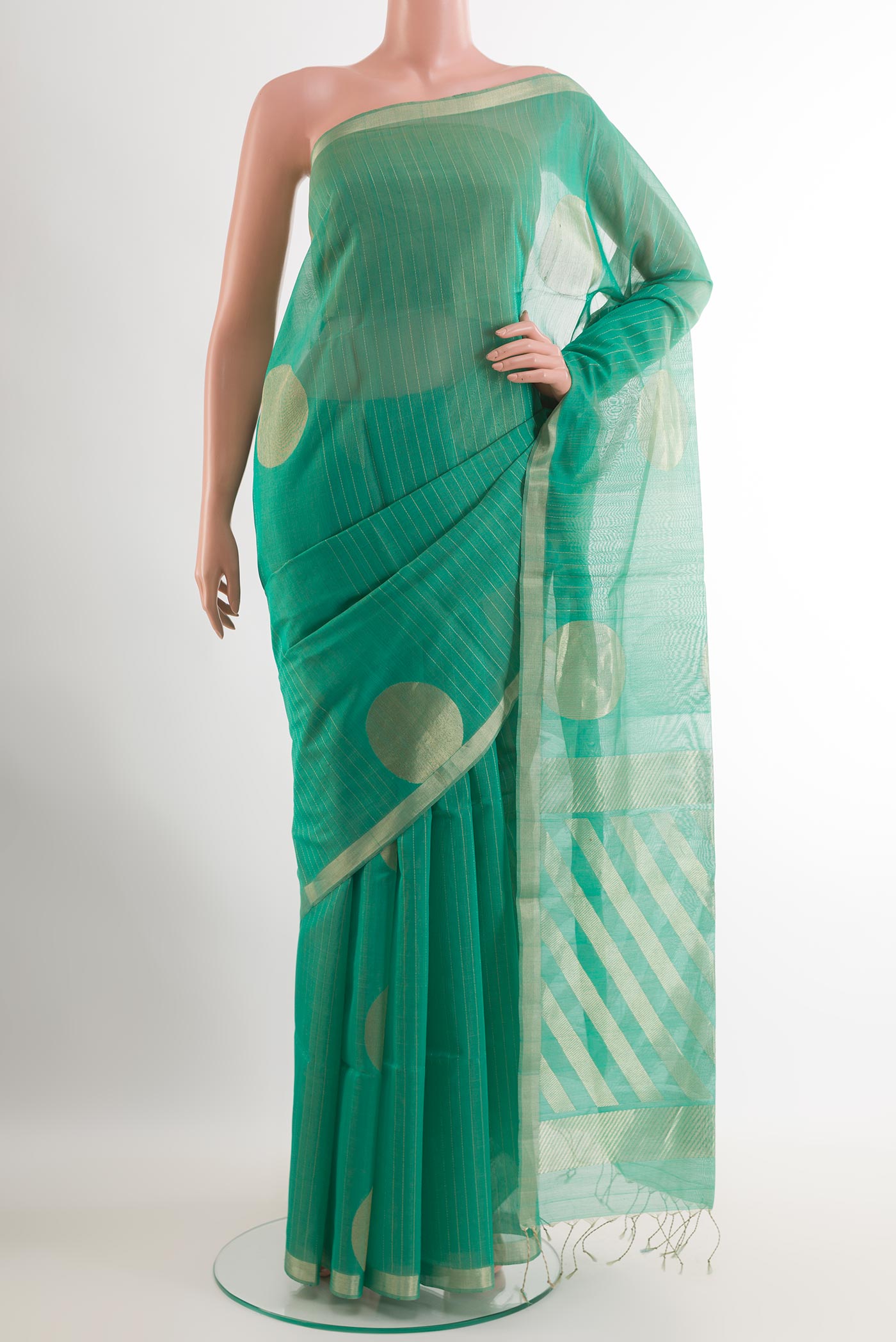 Sea Green Blended Kora Cotton Saree with Stripes on the body and Zari Border.  displayed on a mannequin