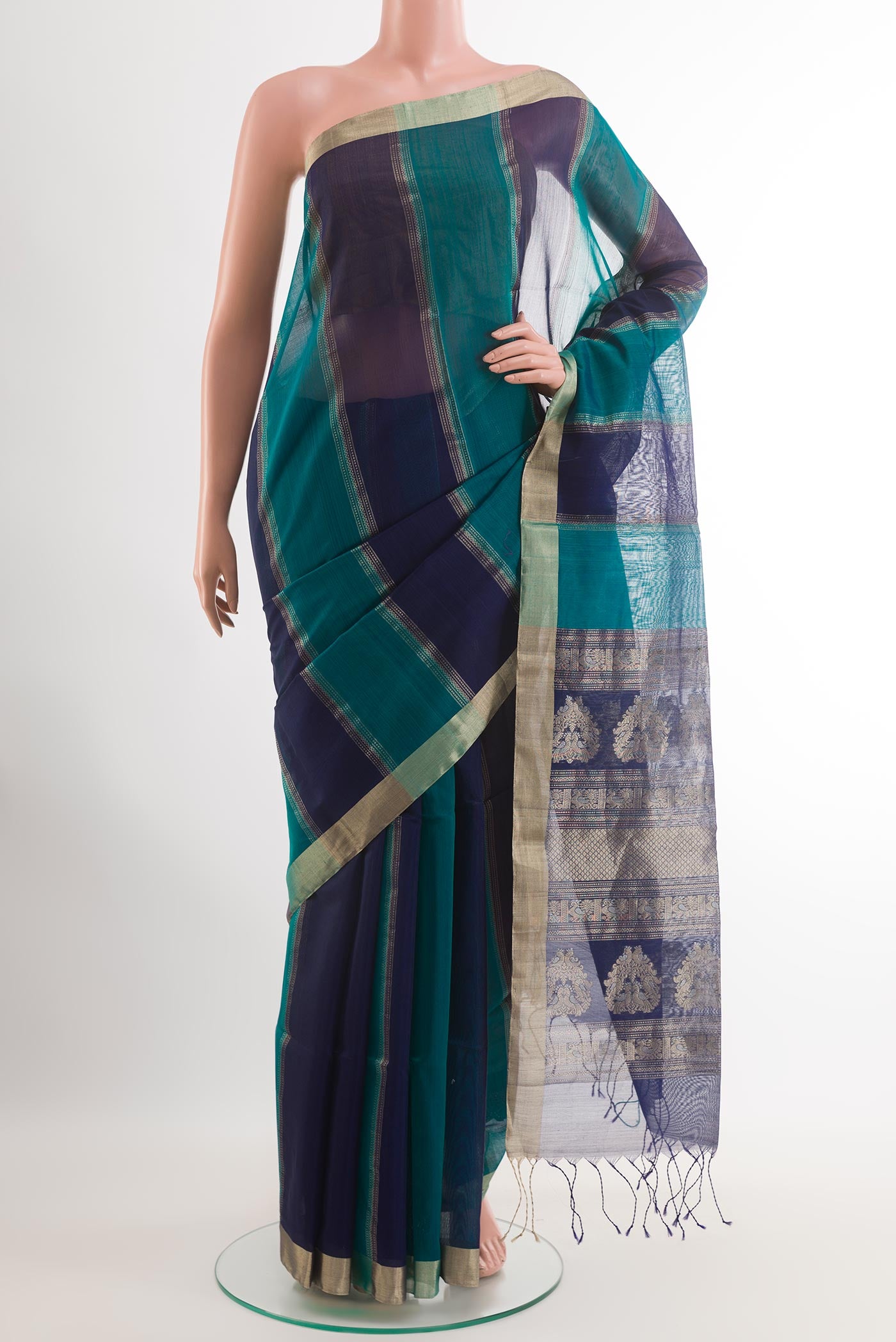 Sea Green Blended Kora Cotton Saree with Stripes on the body and Zari Border.  displayed on a mannequin