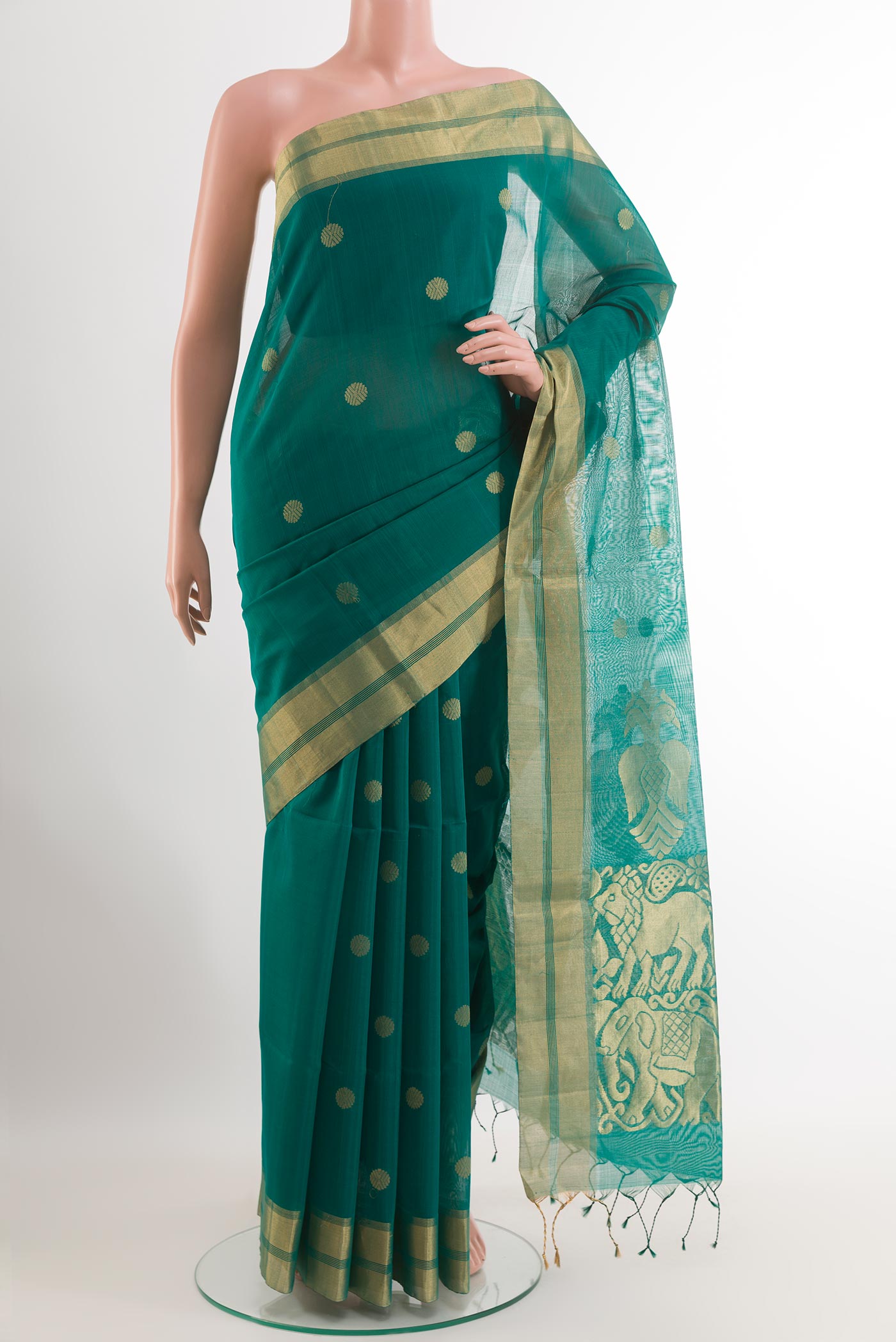 Green Blended Kora Cotton Saree with Zari Butta on the body and Zari Border.  displayed on a mannequin