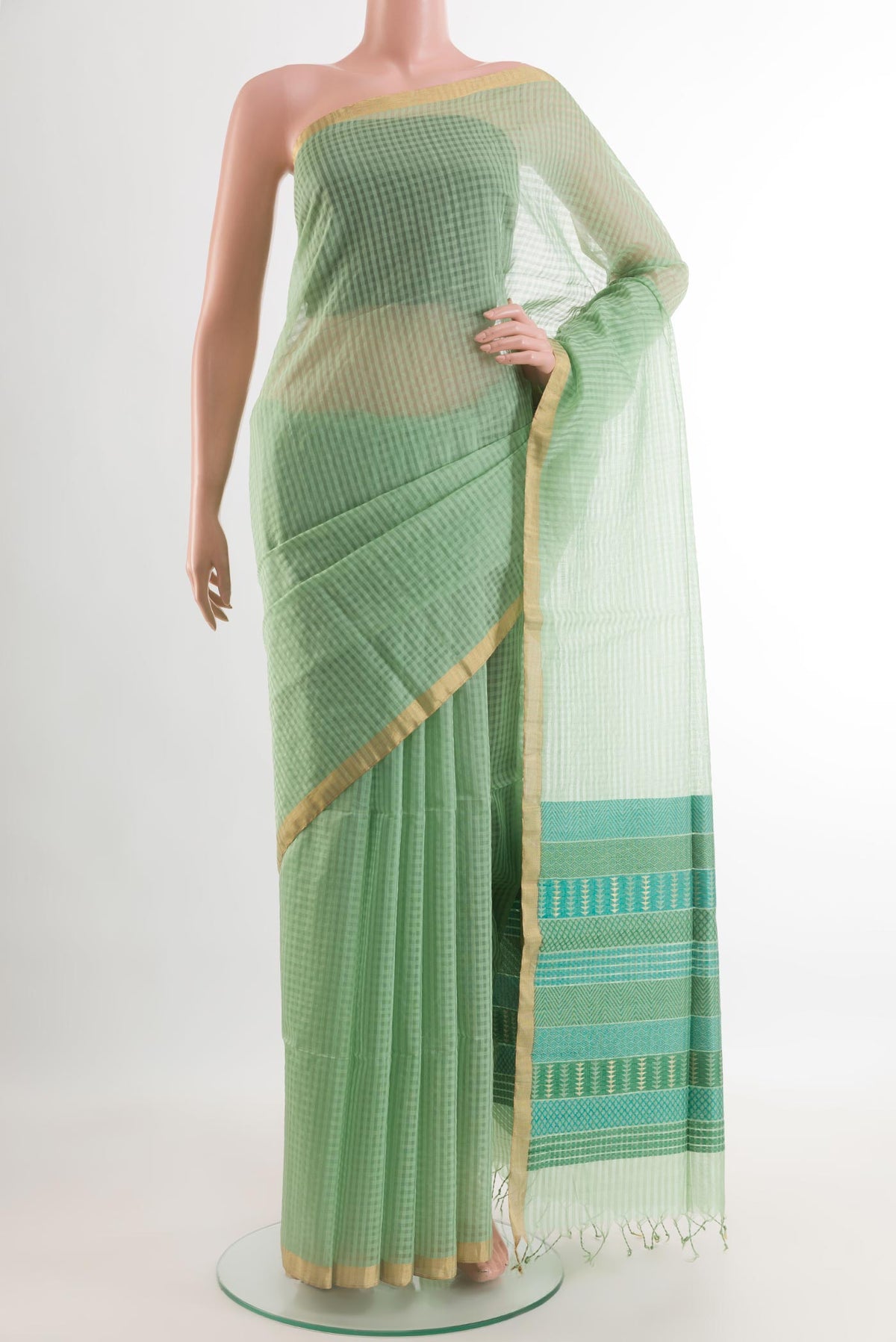 Sea Green Silk Cotton Saree with Checked design on the body and Zari Border.  displayed on a mannequin