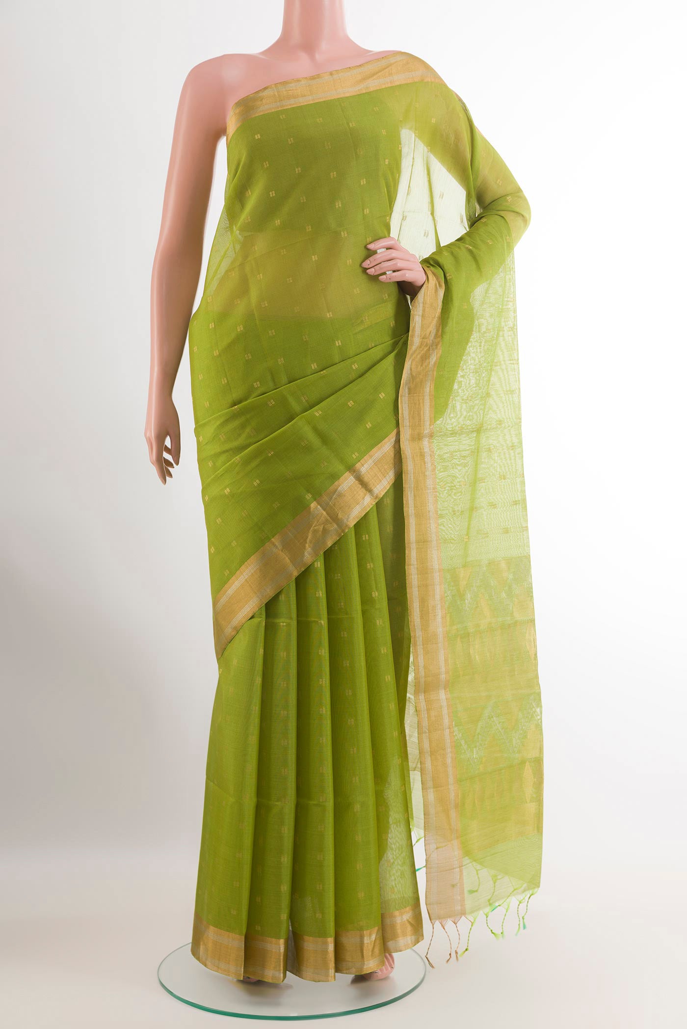 Green Blended Kora Cotton Saree with Zari Butta on the body and Zari Border.  displayed on a mannequin