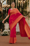 Model wearing a Red Kanchipuram Silk Saree with Zari Butta on the body and Zari Border.