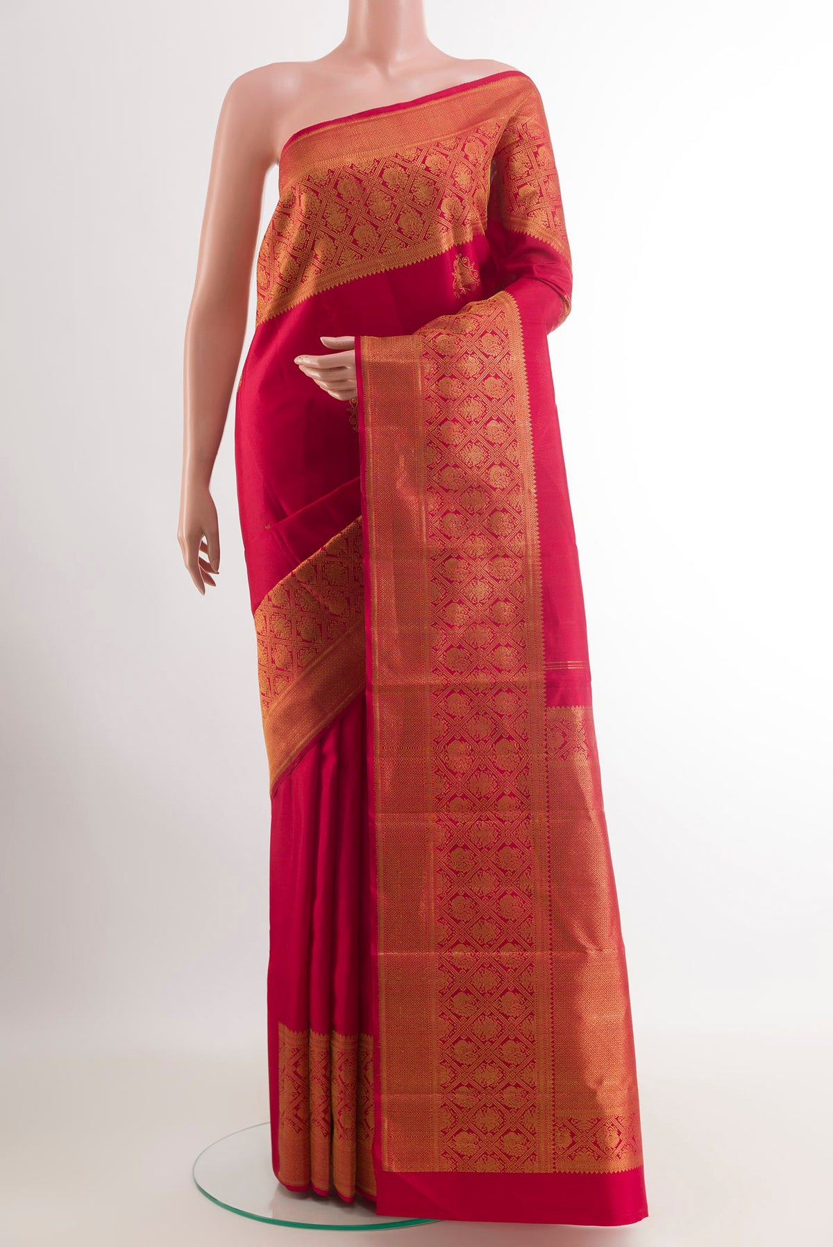 Red Kanchipuram Silk Saree with Zari Butta on the body and Zari Border.  displayed on a mannequin