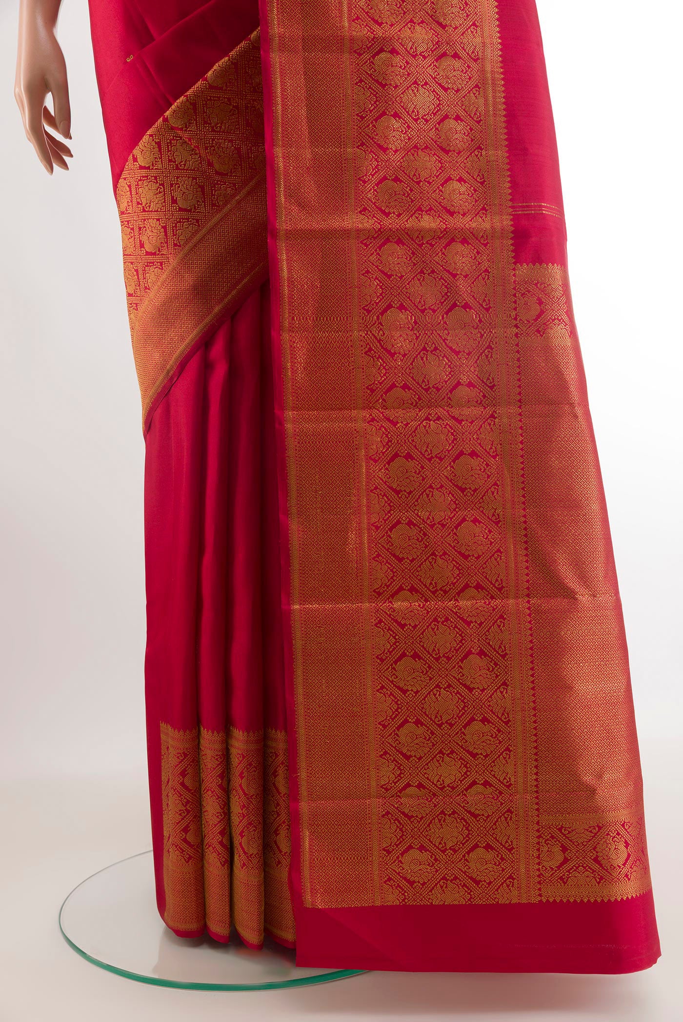 Pleats and pallu of Red Kanchipuram Silk Saree with Zari Butta on the body and Zari Border. 