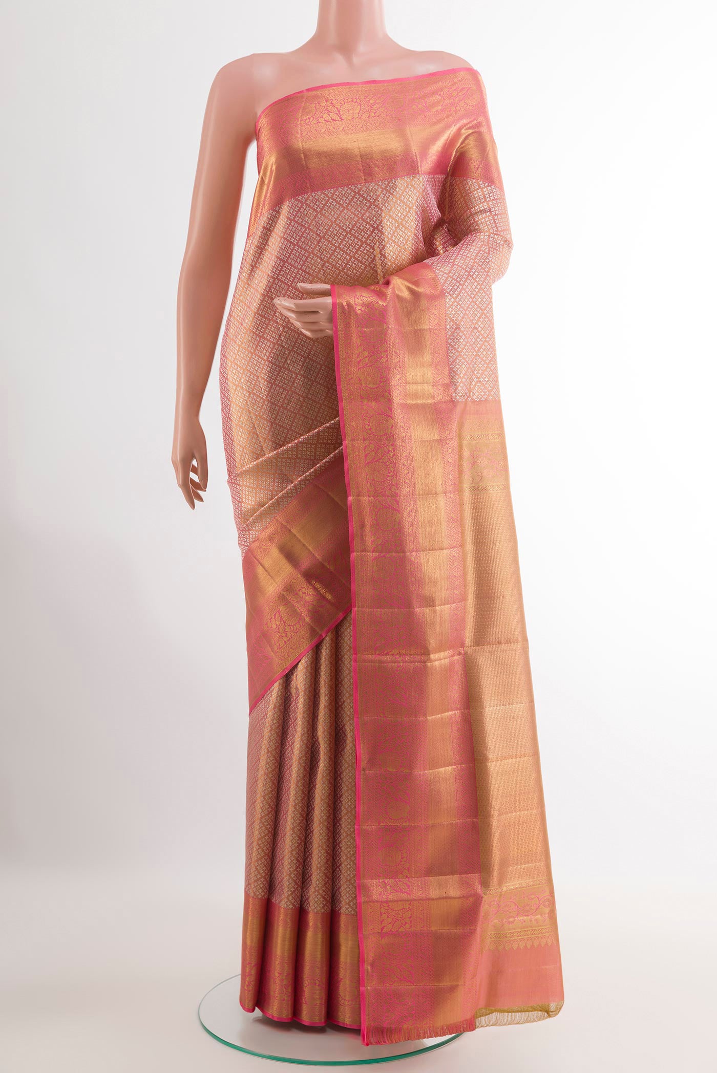 Rose Gold Kanjivaram Tissue Silk Saree with Zari Brocade on the body and Zari Border.  displayed on a mannequin