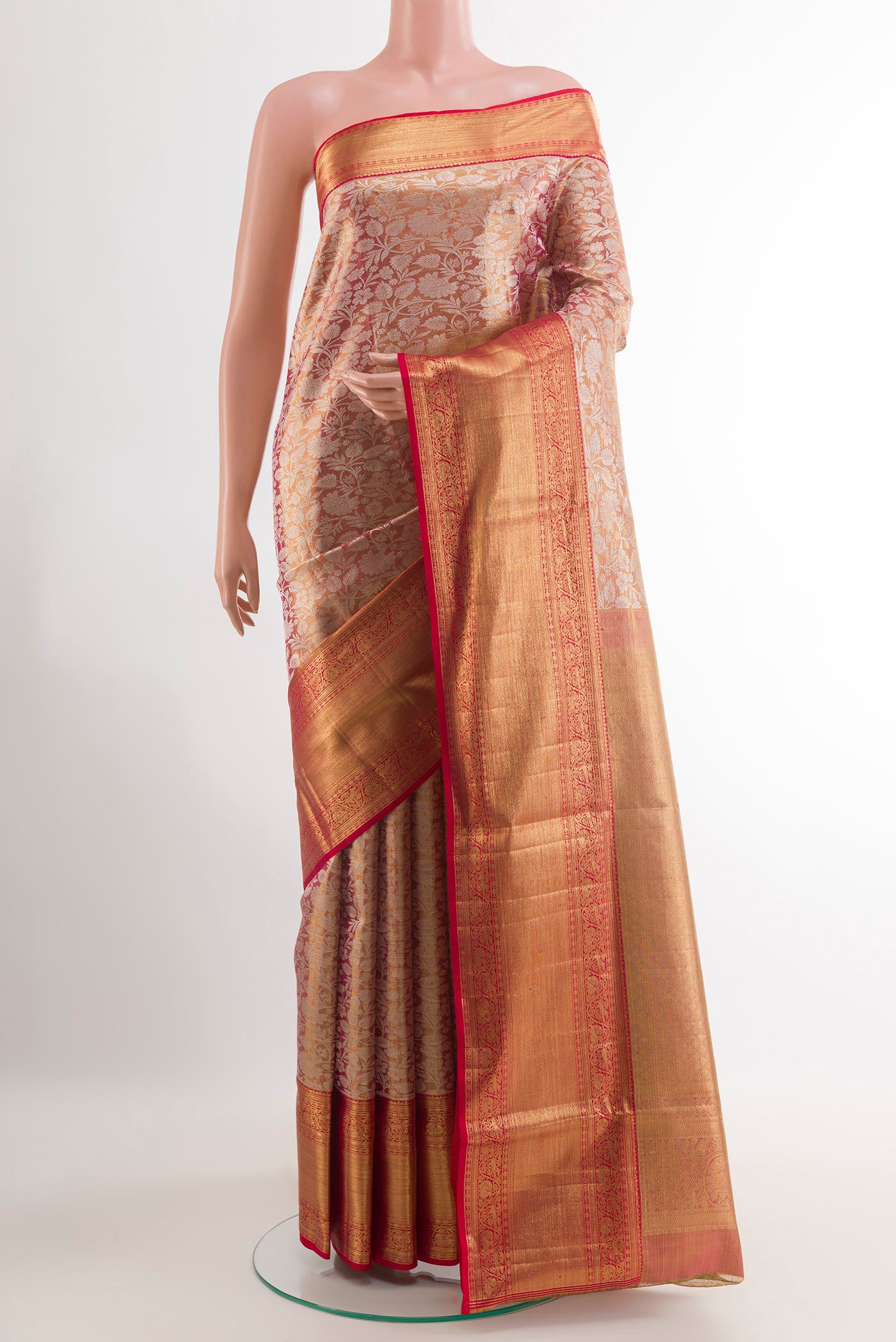 Golden Peach Kanjivaram Tissue Silk Saree with Zari Brocade on the body and Zari Border.  displayed on a mannequin
