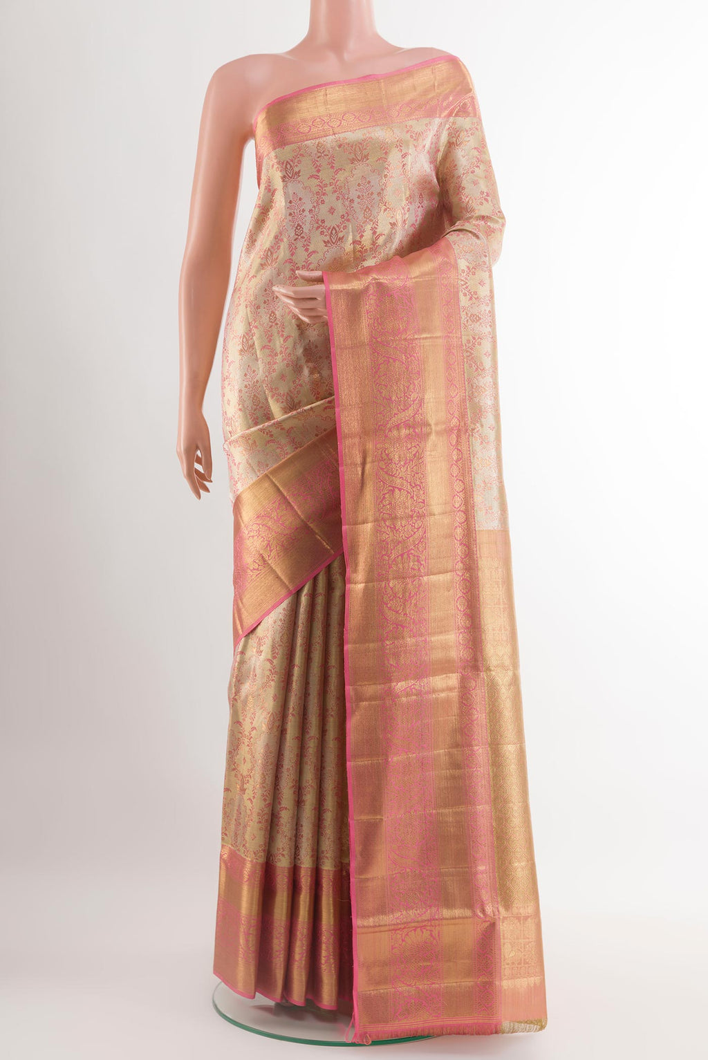 Rose Gold Kanjivaram Tissue Silk Saree with Zari Brocade on the body and Zari Border.  displayed on a mannequin