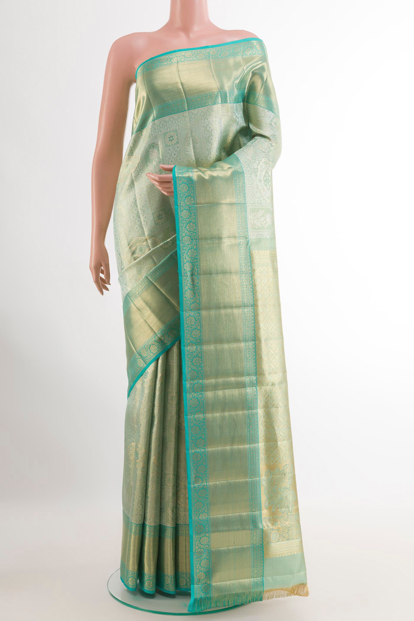 Sea Green Kanjivaram Tissue Silk Saree with Zari Brocade on the body and Zari Border.  displayed on a mannequin