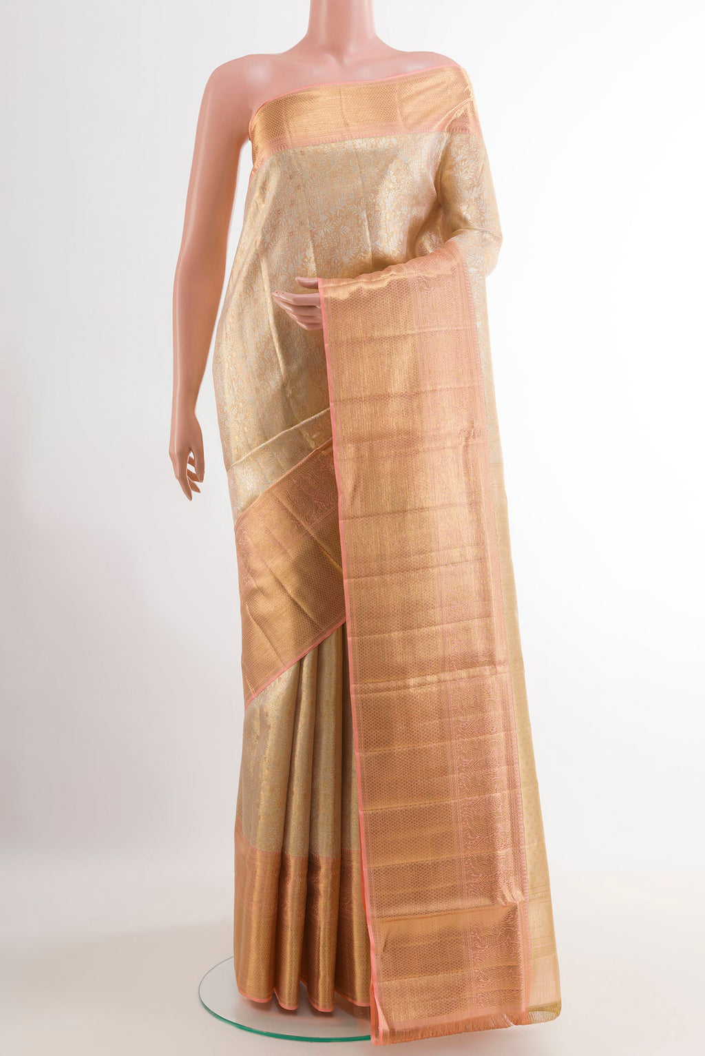 Rose Gold Kanjivaram Tissue Silk Saree with Zari Brocade on the body and Zari Border.  displayed on a mannequin