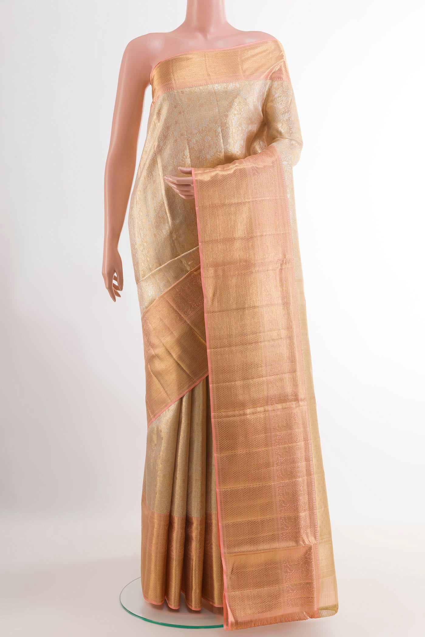 Rose Gold Kanjivaram Tissue Silk Saree with Zari Brocade on the body and Zari Border.  displayed on a mannequin