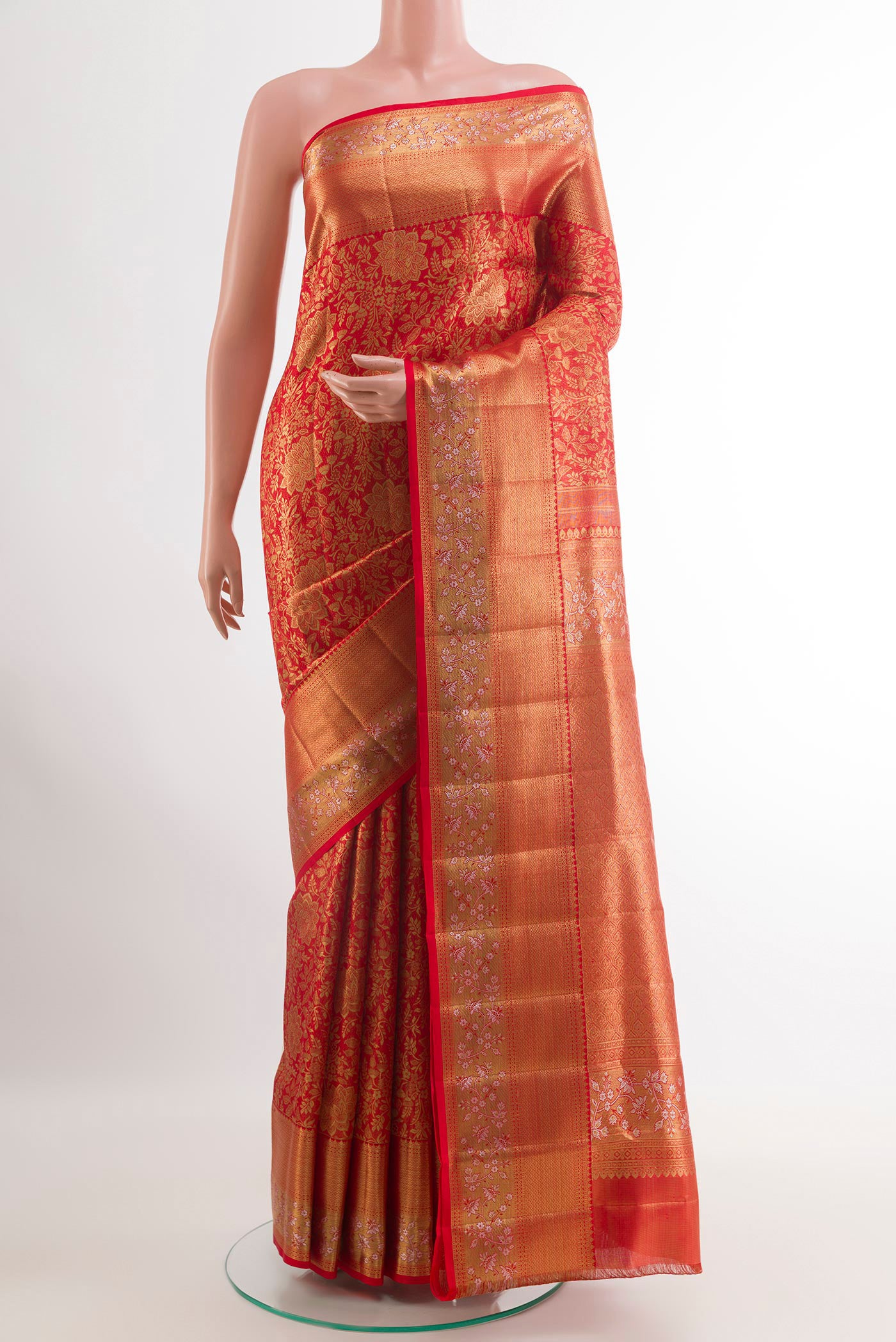 Red Kanjivaram Tissue Silk Saree with Zari Brocade on the body and Zari Border.  displayed on a mannequin