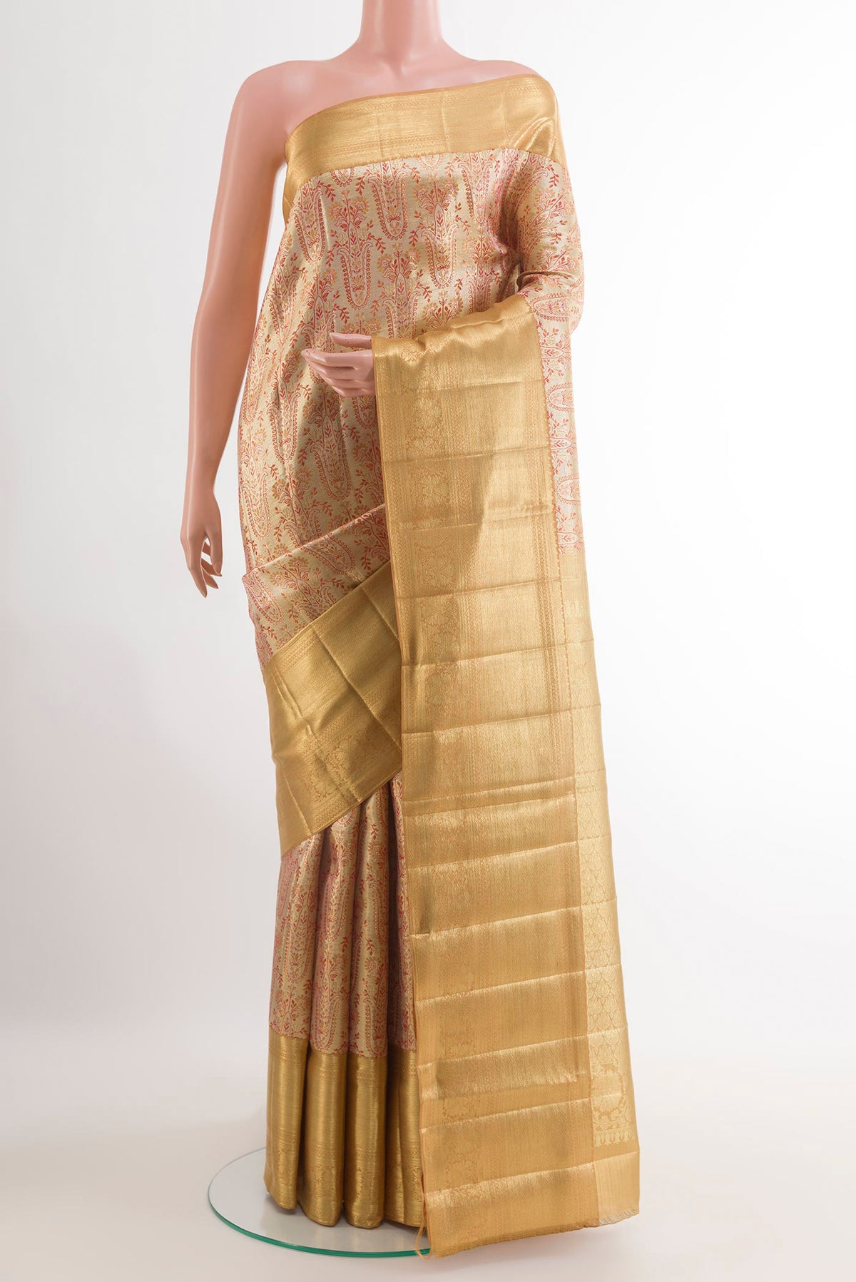 Golden Kanjivaram Tissue Silk Saree with Zari Brocade on the body and Zari Border.  displayed on a mannequin