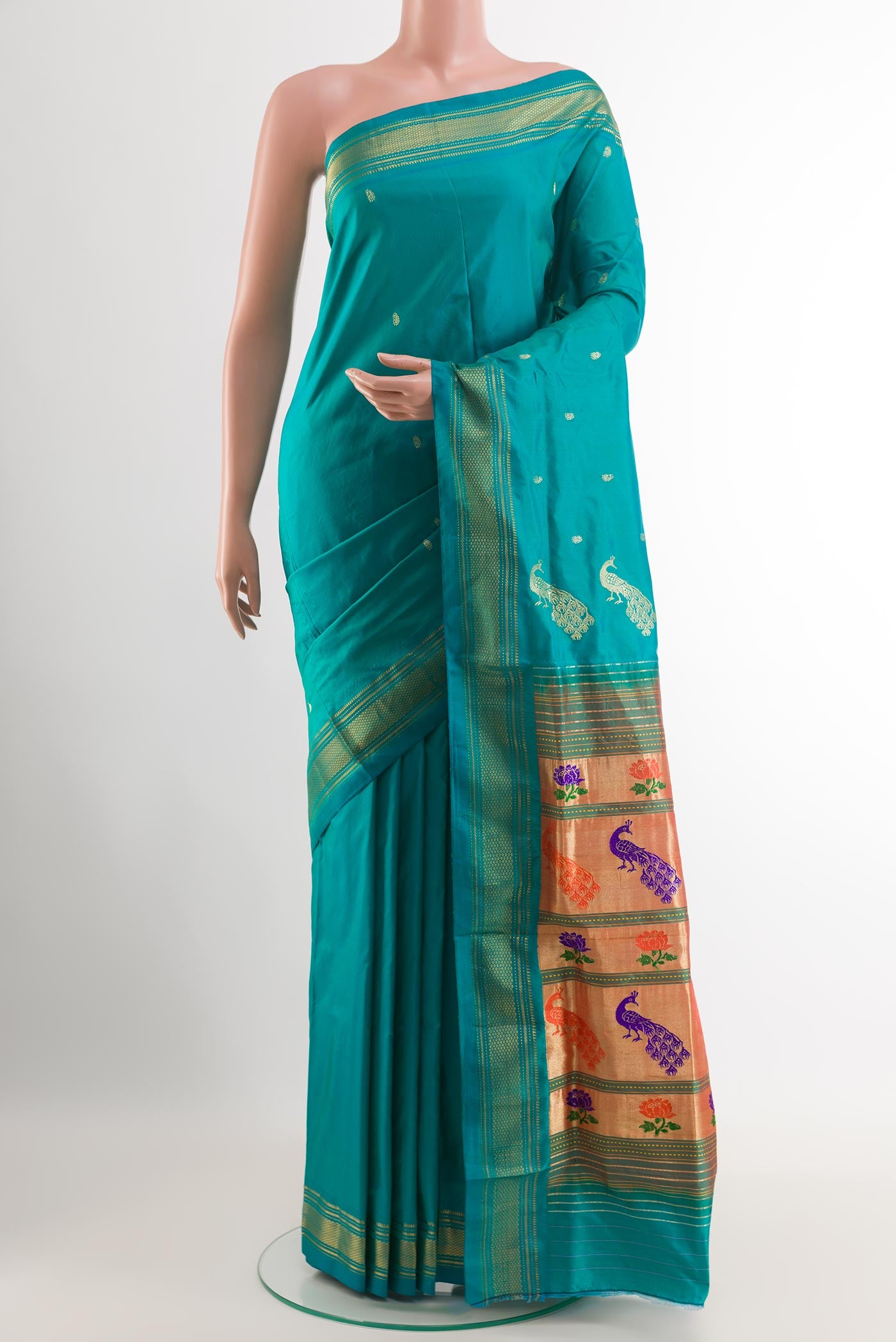 Blue Paithani Silk Saree with Zari Butta on the body and Zari Border.  displayed on a mannequin