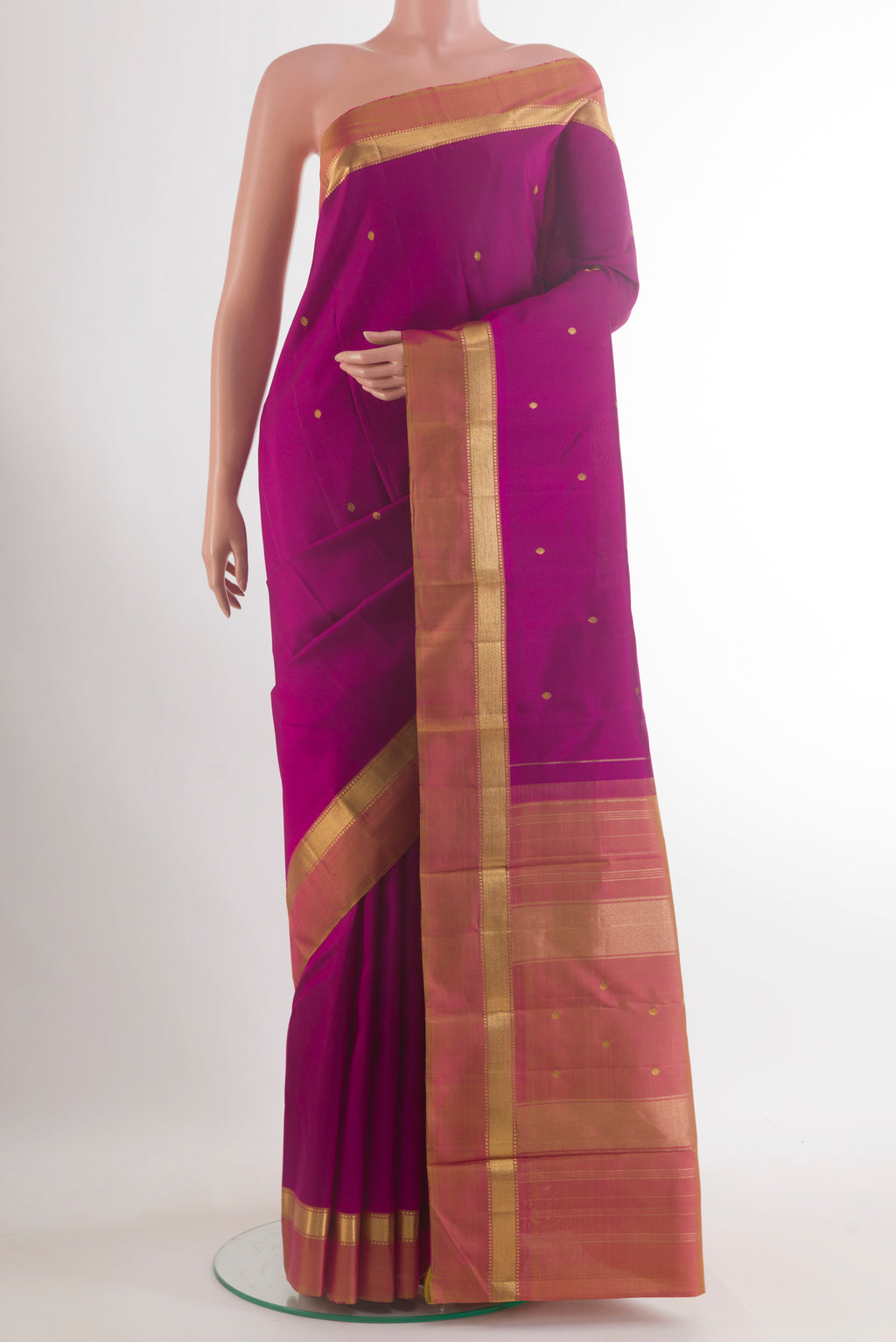 Pure Silk Magenta Kanchipuram Saree with Zari Butta on the body and Zari Border.  displayed on a mannequin