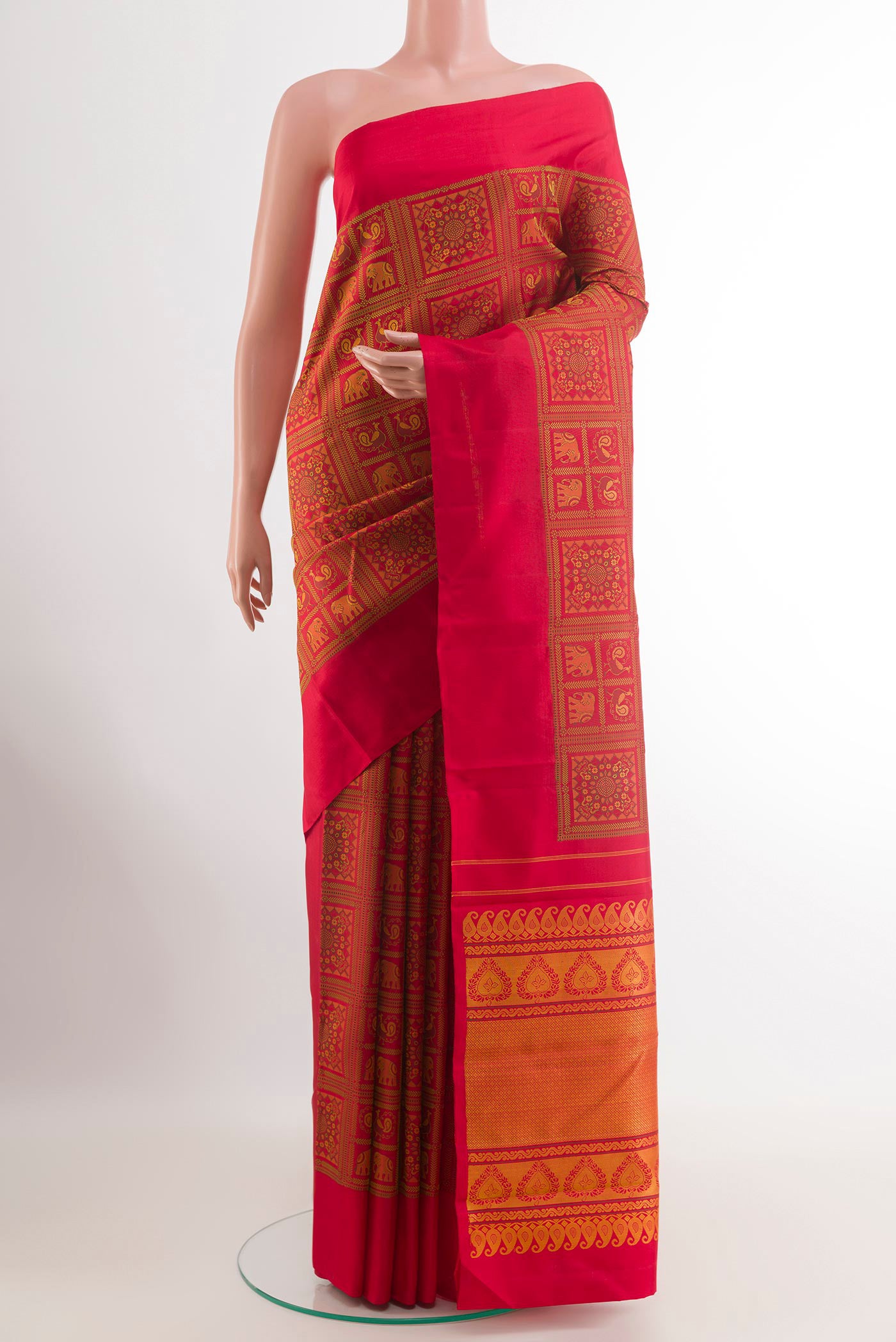 Red Kanjivaram Silk Saree with Embroidery on the body and Plain Border.  displayed on a mannequin
