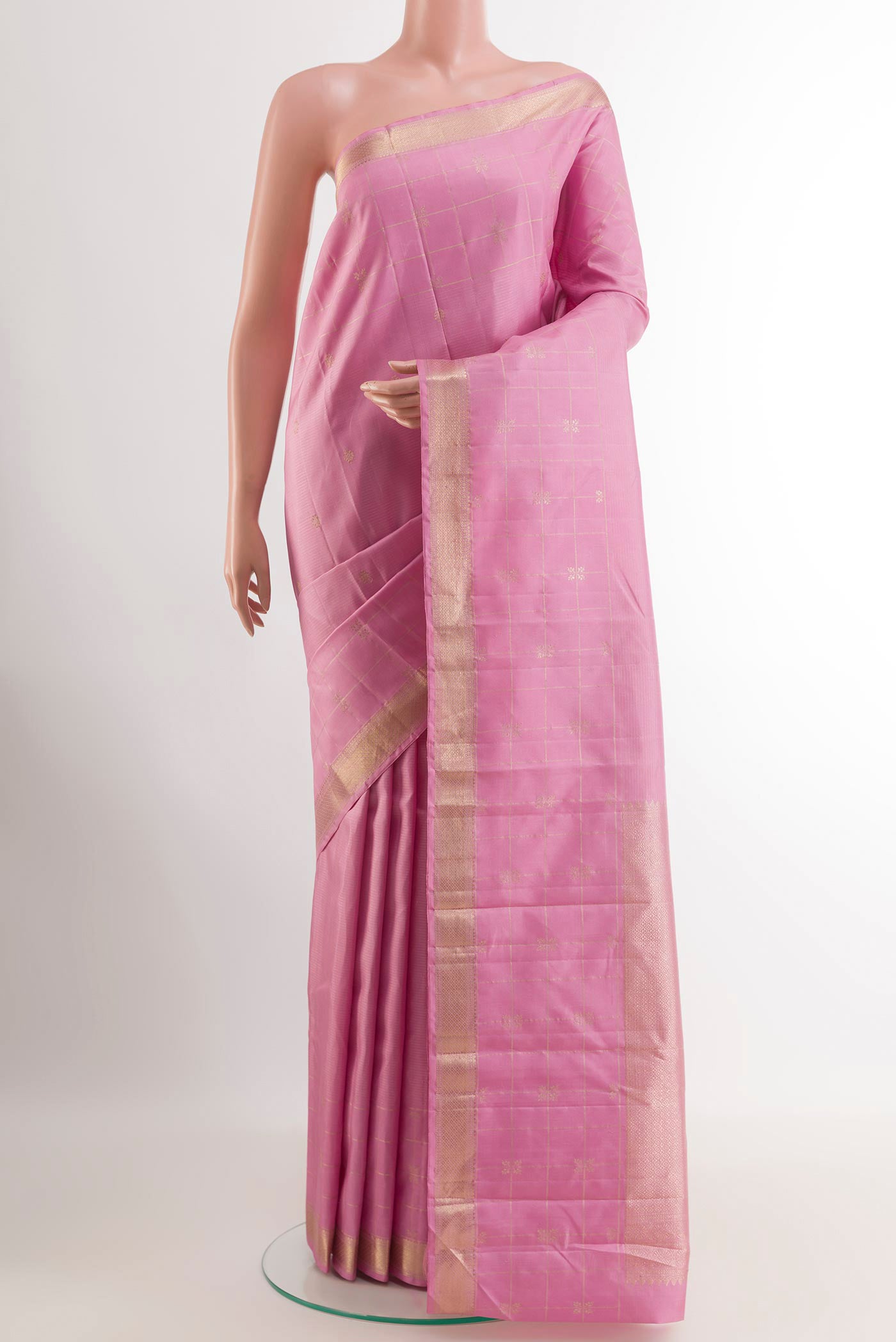 Pink Kanjivaram Silk Saree with Zari Butta on the body and Zari Border.  displayed on a mannequin