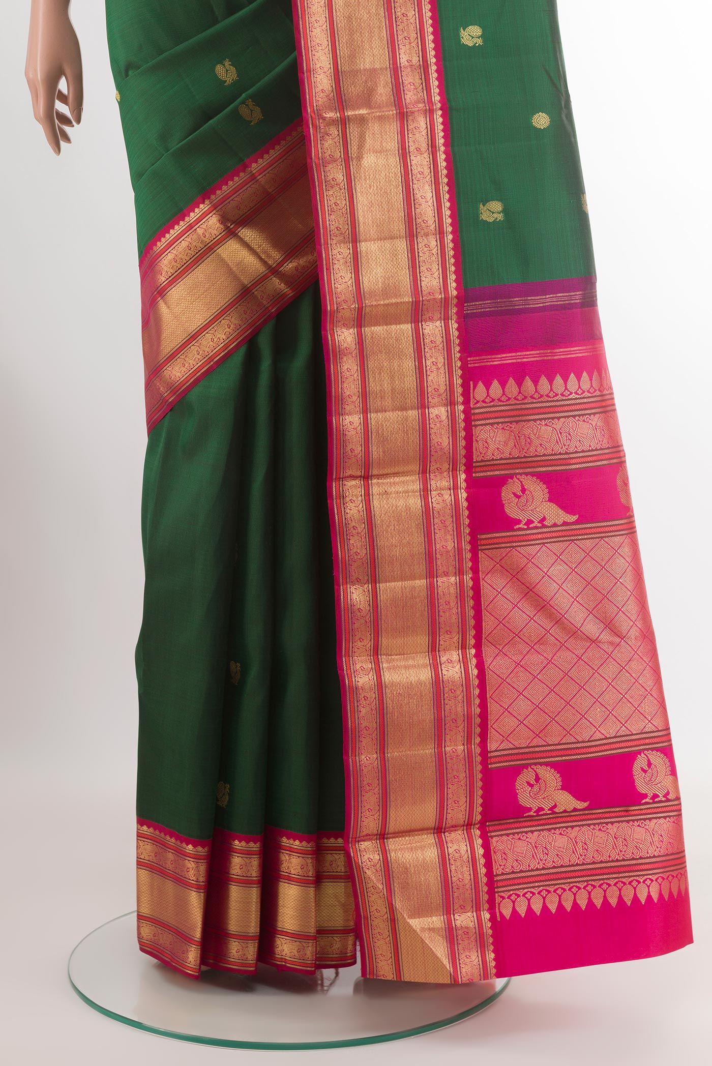 Pleats and pallu of Green Kanjivaram Silk Saree with Zari Butta on the body and Zari Border. 