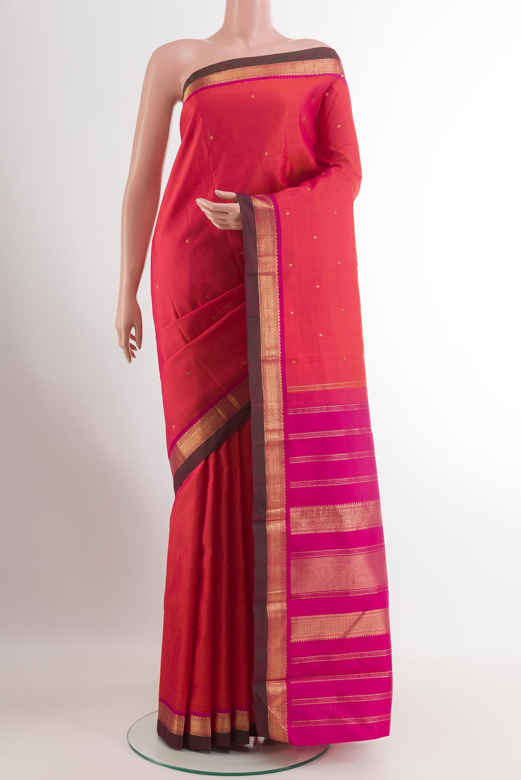 Red Kanchipuram Silk Saree with Zari Butta on the body and Zari Border.  displayed on a mannequin
